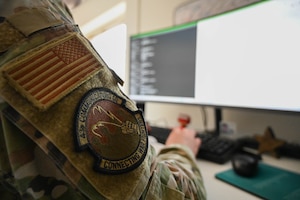 A unit patch sits affixed to an Airman's uniform.
