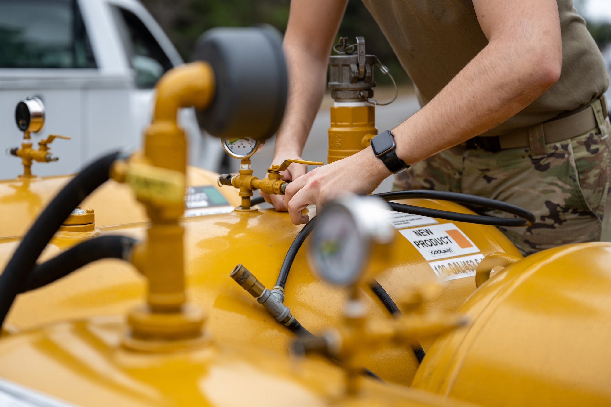 A U.S. Air Force power production specialist assigned to the 1st Special Operations Wing connects a hose to an oil vac at Hurlburt Field, Florida, Jan. 13, 2025.