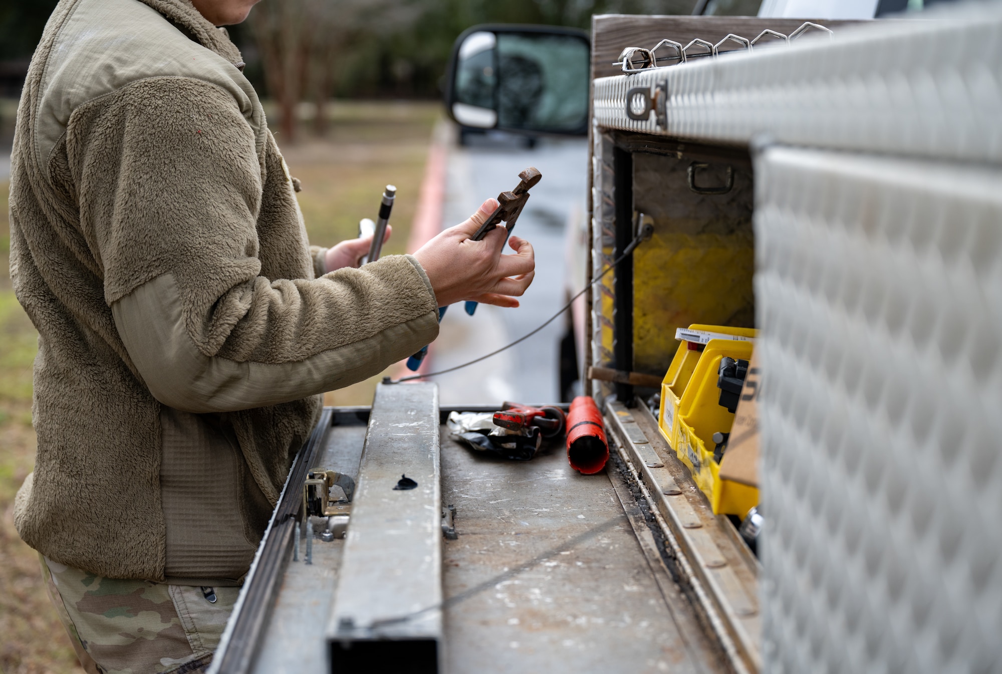A U.S. Air Force civil engineer assigned to the 1st Special Operations Wing gathers tools before beginning a work order at Hurlburt Field, Florida, Jan. 13, 2025.