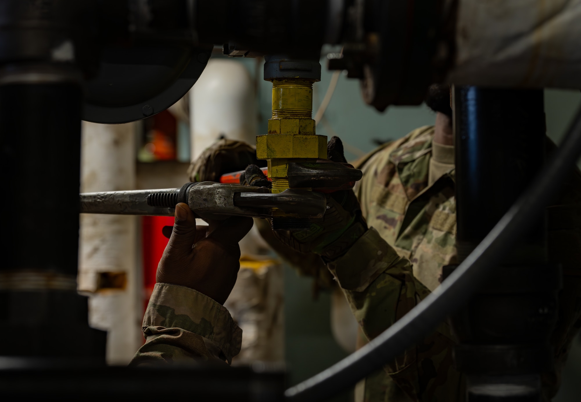 U.S. Air Force civil engineers assigned to the 1st Special Operations Wing detach and lower a metal reducer at Hurlburt Field, Florida, Jan. 13, 2025.