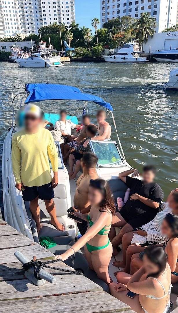 Coast Guard Sector Miami law enforcement officers, along with federal and state law enforcement partners, conduct a boarding on a 46-foot cabin cruiser, Isabella, in the vicinity of Lummus Park, Florida, May 18, 2025. The owner of Isabella was reportedly operating as an illegal small passenger vessel in violation of an active Captain of the Port order issued two days prior, for failing to properly execute a charter agreement. (U.S. Coast Guard photo)