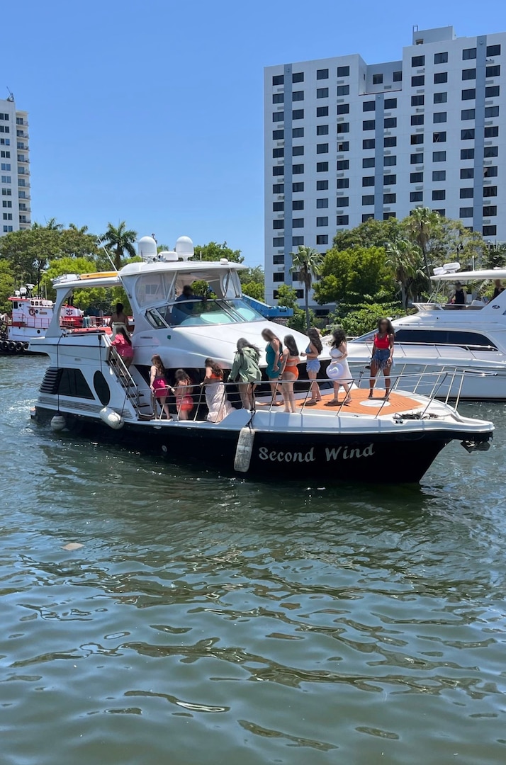 Coast Guard Sector Miami law enforcement officers, along with federal and state law enforcement partners, conduct a boarding on a 46-foot cabin cruiser, Isabella, in the vicinity of Lummus Park, Florida, May 18, 2025. The owner of Isabella was reportedly operating as an illegal small passenger vessel in violation of an active Captain of the Port order issued two days prior, for failing to properly execute a charter agreement. (U.S. Coast Guard photo)