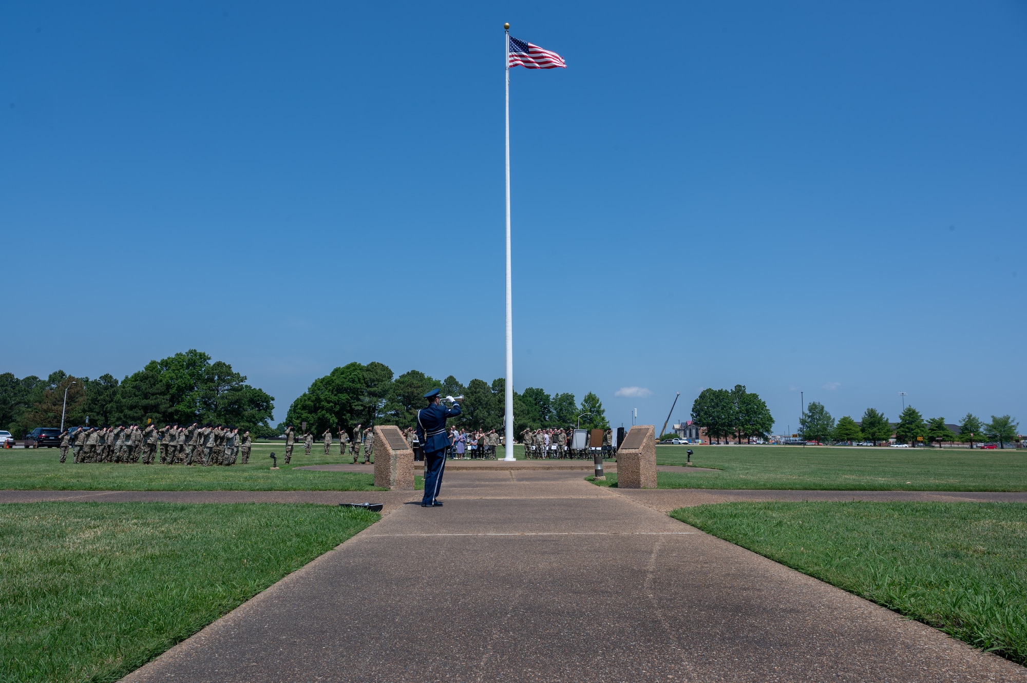 Airmen salute a flag. (U.S. Air Force photo by Senior Airman Ian Sullens)