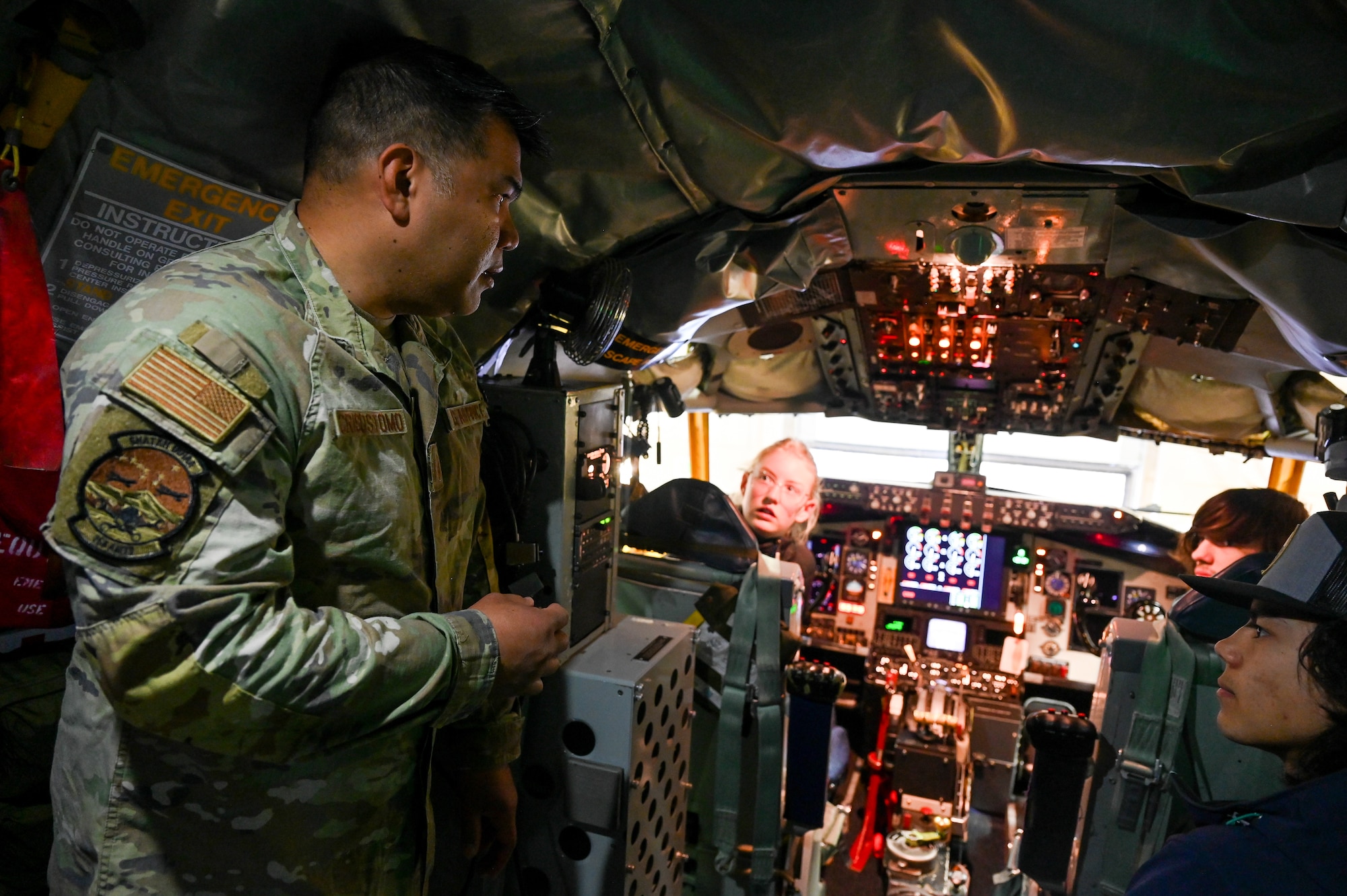 Master Sgt. Anthony Cristostomo, a member of the 168th Maintenance Group explains the 168th Wing air refueling mission on board a KC-135 Stratotanker cockpit during the May drill weekend’s Bring a Buddy to Work event.
