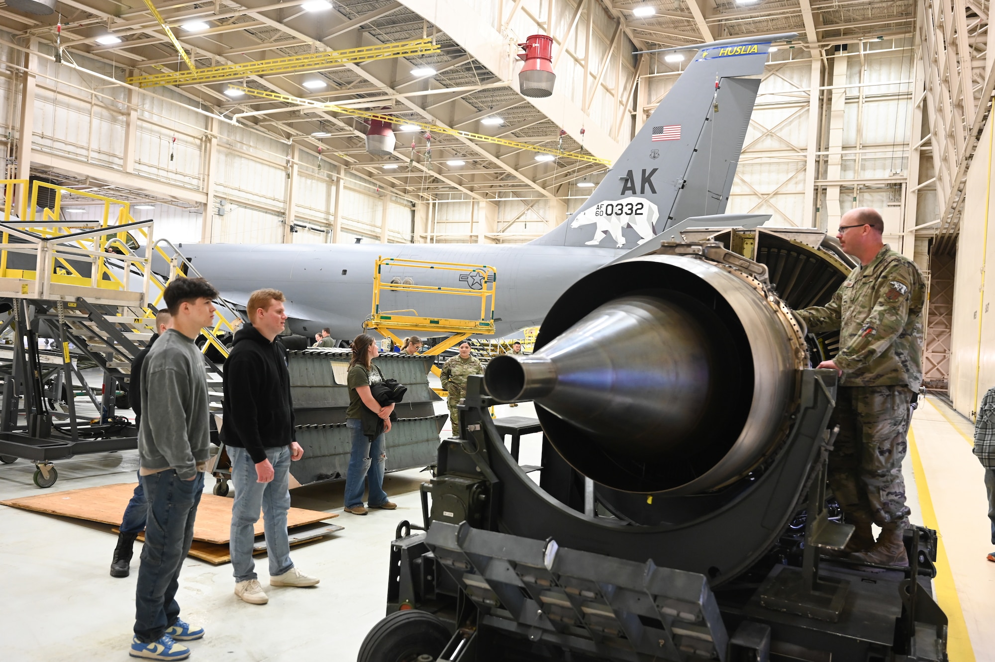 Master Sgt. David Snapp, 168th Maintenance Group explains the engine shop mission in the maintenance hangar during May drill weekend’s Bring a Buddy to Work event.
