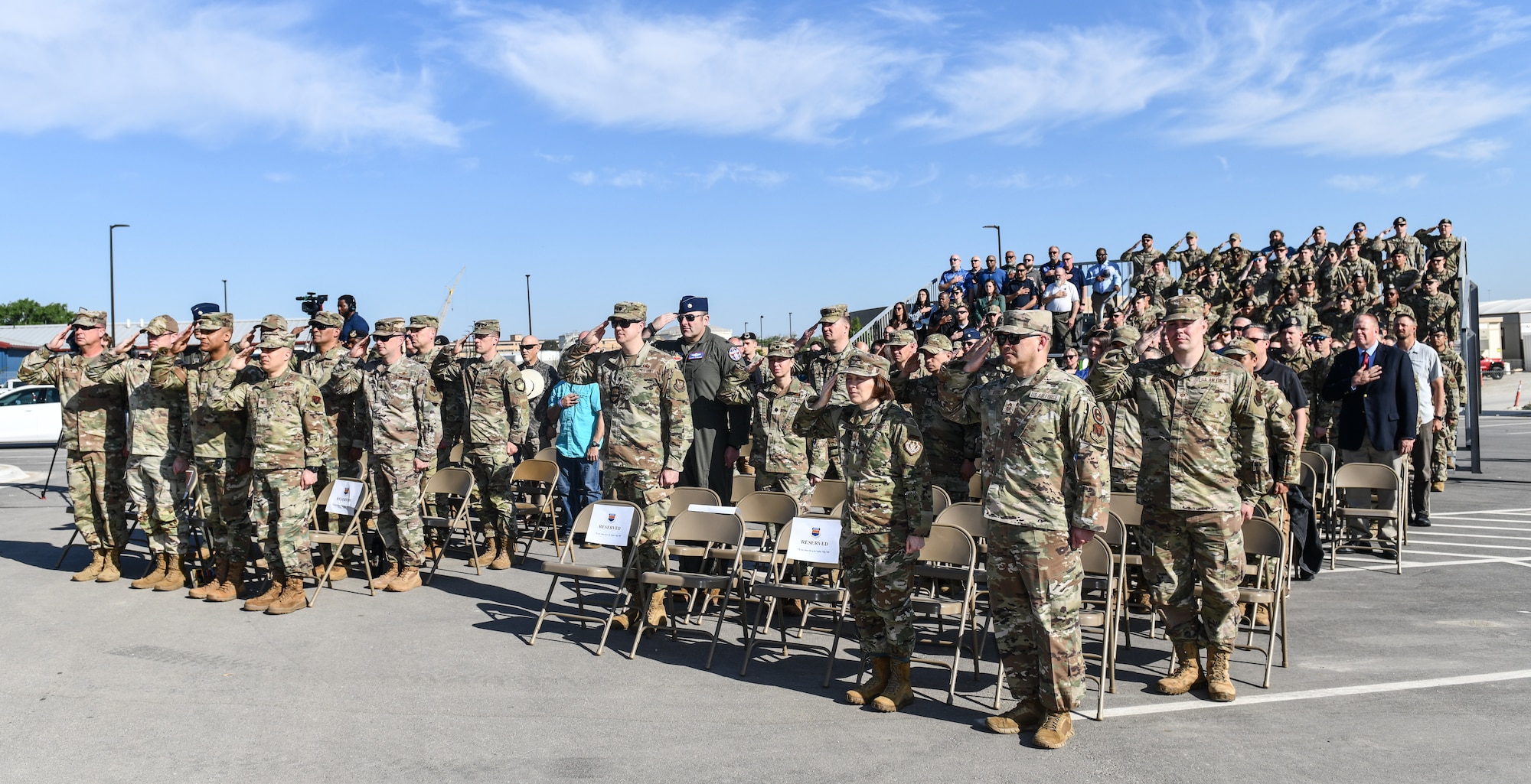 Attendees salute the colors during the opening ceremonies of the 55th Security Forces ribbon cutting ceremony at Offutt Air Force Base, May 12. (U.S. Air Force photo by Chad Watkins)