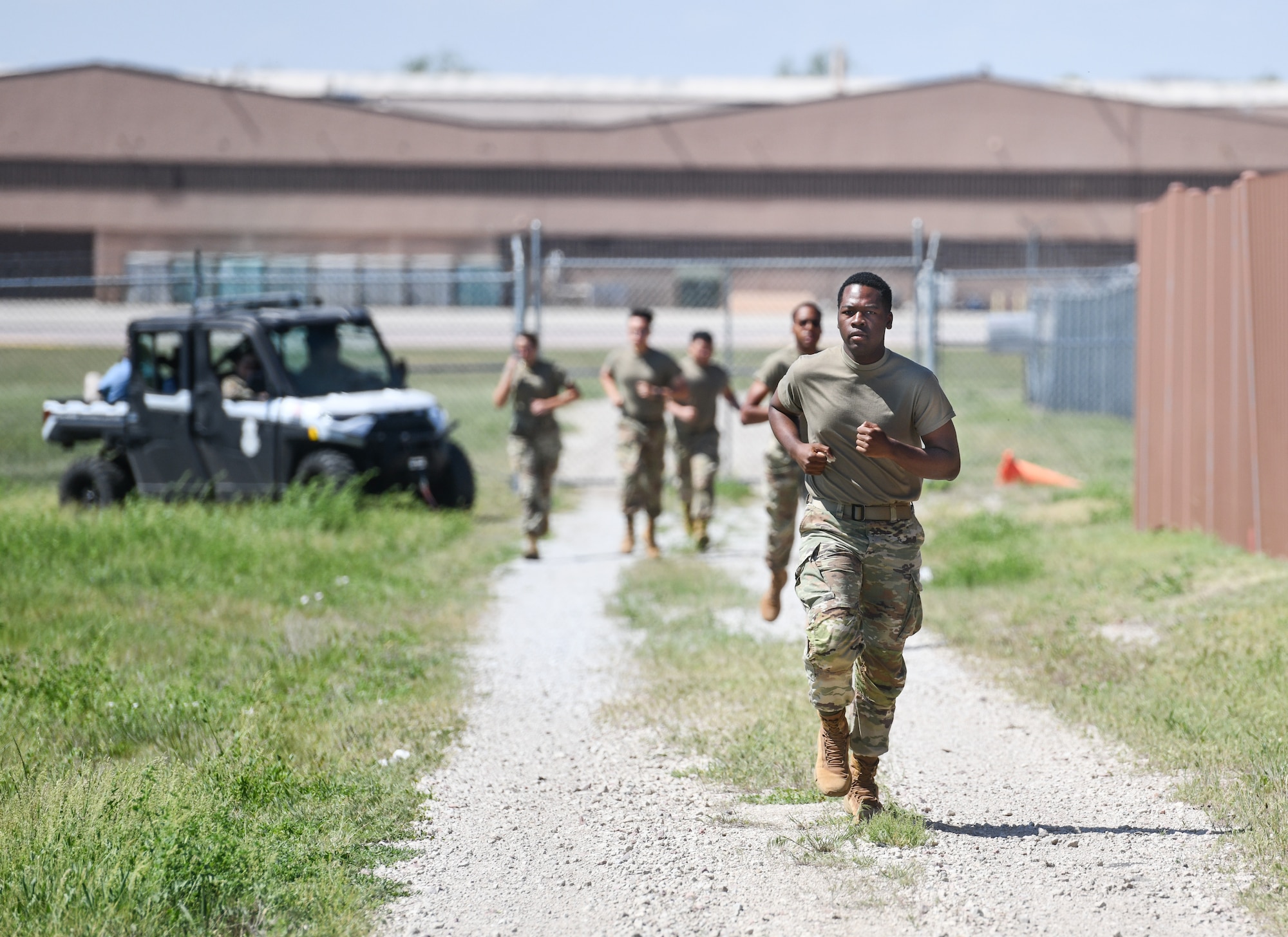 Airman Deshawn Reeves, 55th Security Forces Squadron, runs ahead of his team during the Fire Team challenge on Offutt Air Force Base, May 14.  The Fire Team challenge was a four man event that featured an obstacle course, memory challenge, and endurance run. (U.S. Air Force photo by Chad Watkins)