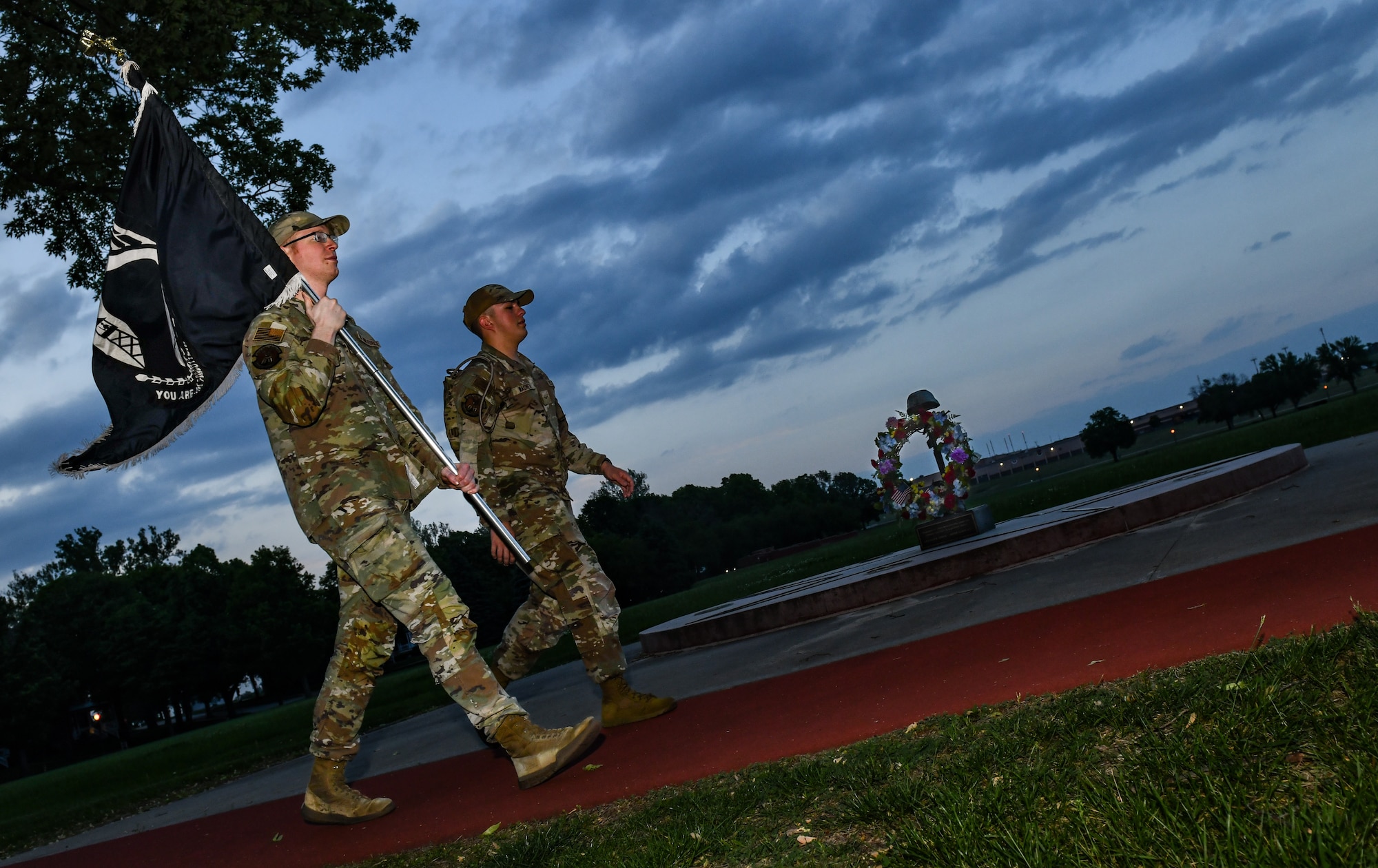Staff Sgt. Joseph Wilmoth, 55th Strategic Communications Squadron, and Airman 1st Class Logan Wagner, 55th SCS, march around the Parade Grounds at Offutt Air Force Base, May 14. National Police Week featured the 24-hour ruck march to honor fallen law enforcement members. (U.S. Air Force photo by Chad Watkins)