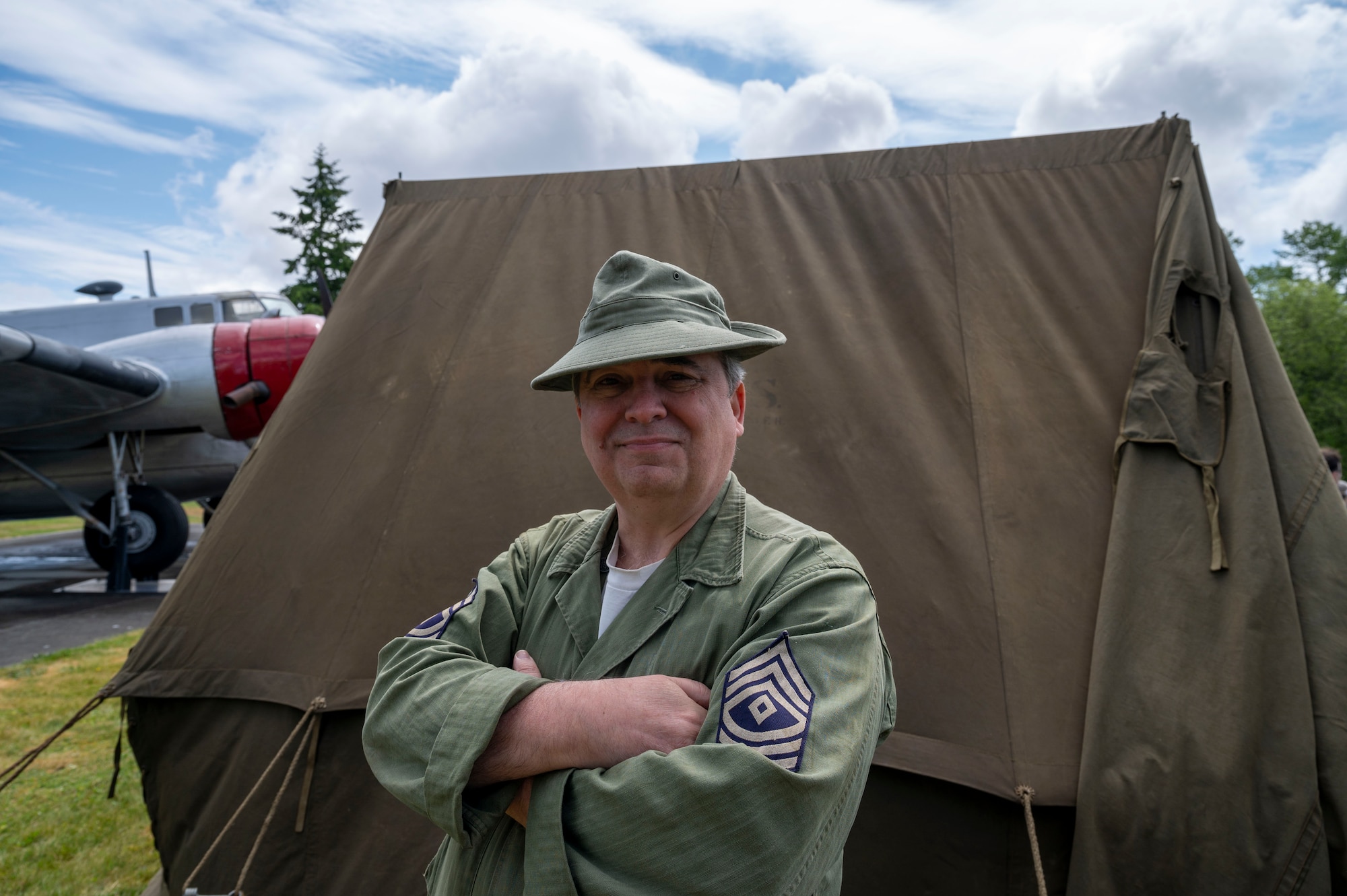 Military historian Peter Grilley from the Friends of Willie and Joe, 161st Infantry Regiment, educates and reenacts the lifestyle of historical soldiers during Armed Forces Day at Joint Base Lewis-McChord, Washington, May 17, 2025.