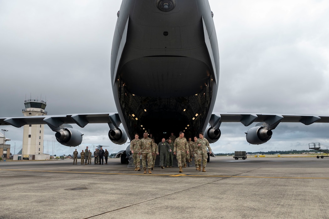 Joint Base Lewis-McChord Airmen and Soldiers exit a C-17 Globemaster III after a series of unit presentations to U.S. Air Force Gen. John Lamontagne, Air Mobility Command commander, at Joint Base Lewis-McChord, Washington, May 19, 2025.