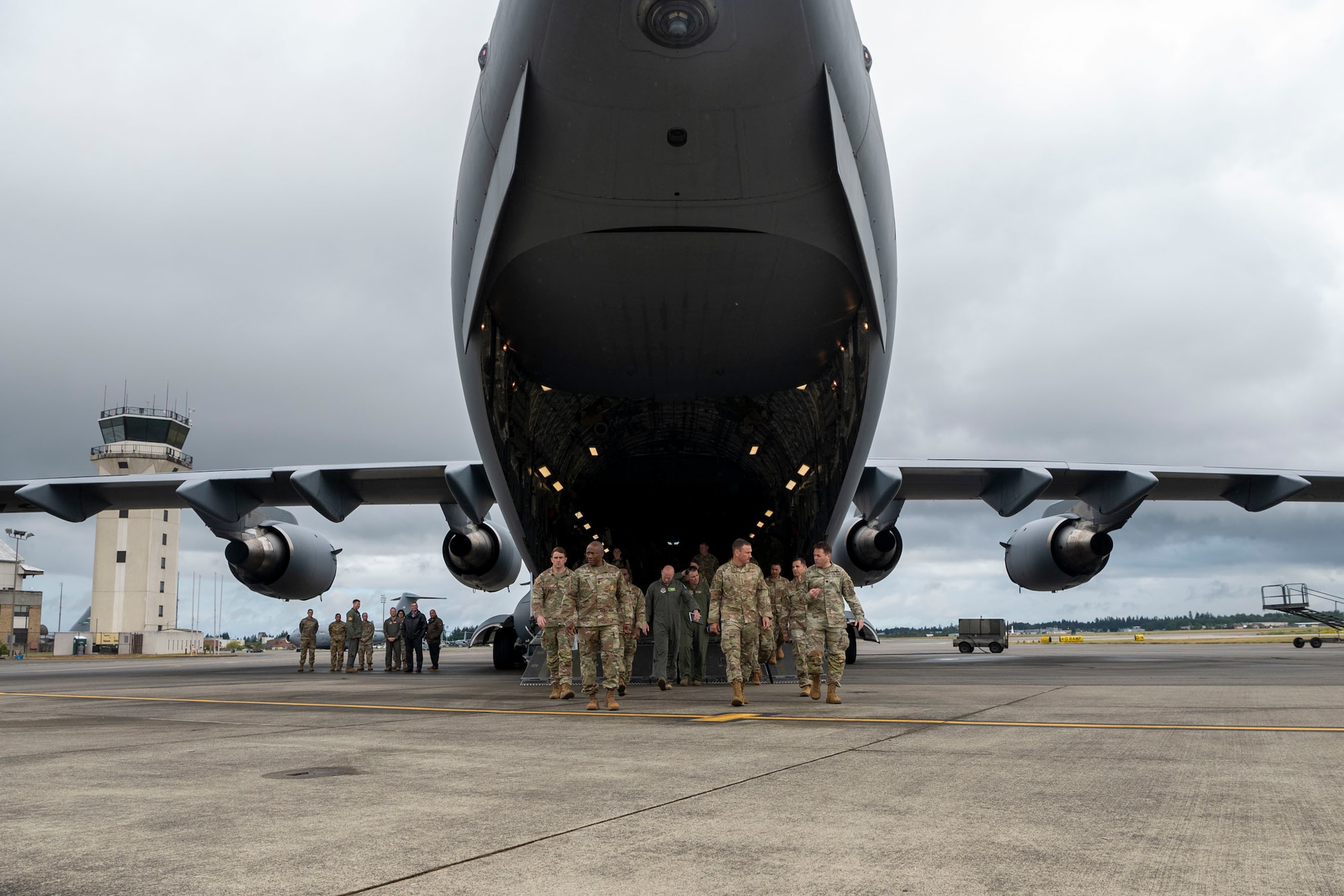Joint Base Lewis-McChord Airmen and Soldiers exit a C-17 Globemaster III after a series of unit presentations to U.S. Air Force Gen. John Lamontagne, Air Mobility Command commander, at Joint Base Lewis-McChord, Washington, May 19, 2025.
