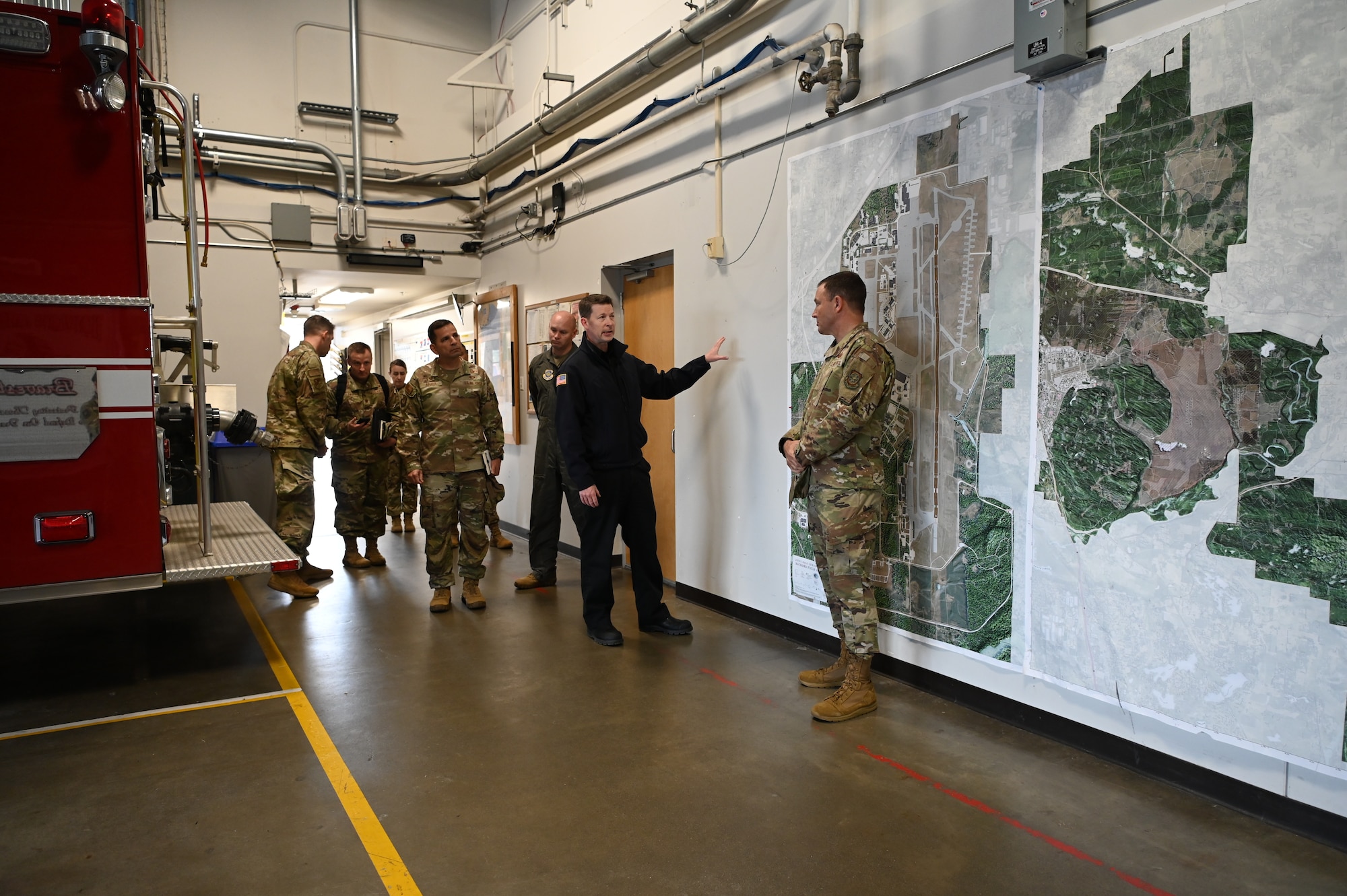 U.S. Air Force Gen. John Lamontagne, Air Mobility Command commander, listens to David Rinard, Fire Station 105 assistant chief, talk about the station’s funding needs at Joint Base Lewis-McChord, Washington, May 19, 2025.