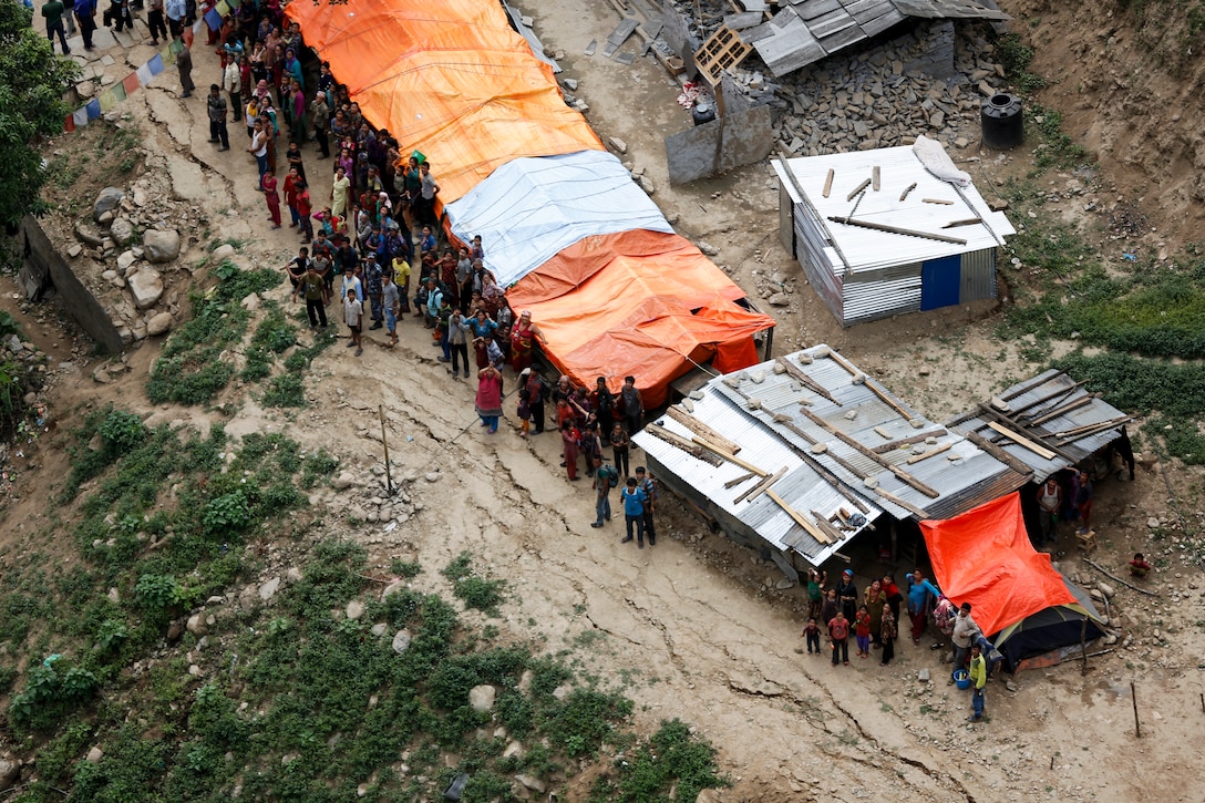 Aerial photo of Nepal showing the conditions of the country after being impacted by two earthquakes with a magnitude greater than 7.0, May 12, 2015 during Operation Sahayogi Haat. JTF 505, along with other multinational forces and humanitarian relief organizations, provided aid to Nepal after a 7.8 magnitude earthquake struck the country April 25 and a 7.3 earthquake on May 12. At Nepal’s request, the U.S. government ordered JTF 505 to provide unique capabilities to assist the country. These are the final photos taken by Cpl. Sara A. Medina before a tragic helicopter crash on May 12, 2015. The helicopter went down during a mission to rescue wounded civilians in Nepal, resulting in the deaths of all on board. The victims included U.S. Marines, Nepalese soldiers and civilians: Lance Cpl. Jacob A. Hug, Sgt. Ward M. Johnson IV, Mr. Lok Bahadur Katawai Chhetri, Mrs. Sabitri Khadka Siwakotl, Mr. Yam Bahadur Khatri, Mr. Sain Dhoj Khatri, Mr. Dhruba Kumar KC, Capt. Dustin R. Lukasiewicz, Cpl. Sara A. Medina, Capt. Christopher L. Norgren, Maj. Tapendra Rawal, Sgt. Eric M. Seaman, and Warrant Officer 1 Basanta Titara.  (U.S. Marine Corps photo by Cpl. Sara Medina)
