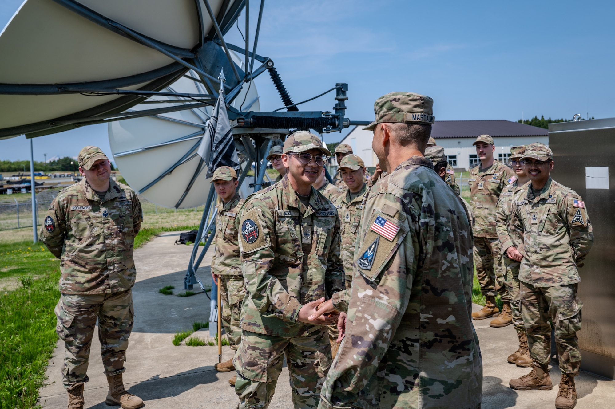 U S Space Force Brigade General Anthony Mastalir, U S Space Forces Indo Pacific commander, right, shakes hands with a Guardian assigned to the 5th Space Warning Squadron Detachment 4 during a visit to Misawa Air Base, Japan.