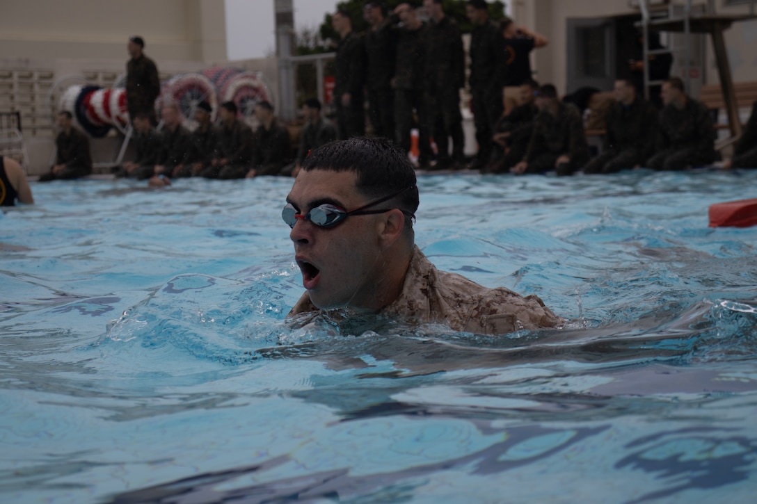 A U.S. Marine with Weapons Company, Battalion Landing Team 1st Battalion, 7th Marine Regiment, 31st Marine Expeditionary Unit, swims laps across a pool as part of Water Survival Advanced training at Camp Hansen, Okinawa, Japan, May 13, 2025. The WSA training teaches Marines how to conduct water rescues, utilize different swim strokes in the water. The 31st MEU, the Marine Corps' only continuously forward-deployed MEU, provides a flexible force ready to perform a wide-range of military operations across the Indo-Pacific region. (U.S. Marine Corps photo by Sgt. Peter Rawlins)