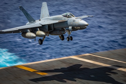 An F/A-18E Super Hornet from the “Kestrels” of Strike Fighter Squadron (VFA) 137 prepares to make an arrested landing on the flight deck of the aircraft carrier USS Nimitz (CVN 68) in the South China Sea, May 14, 2025.