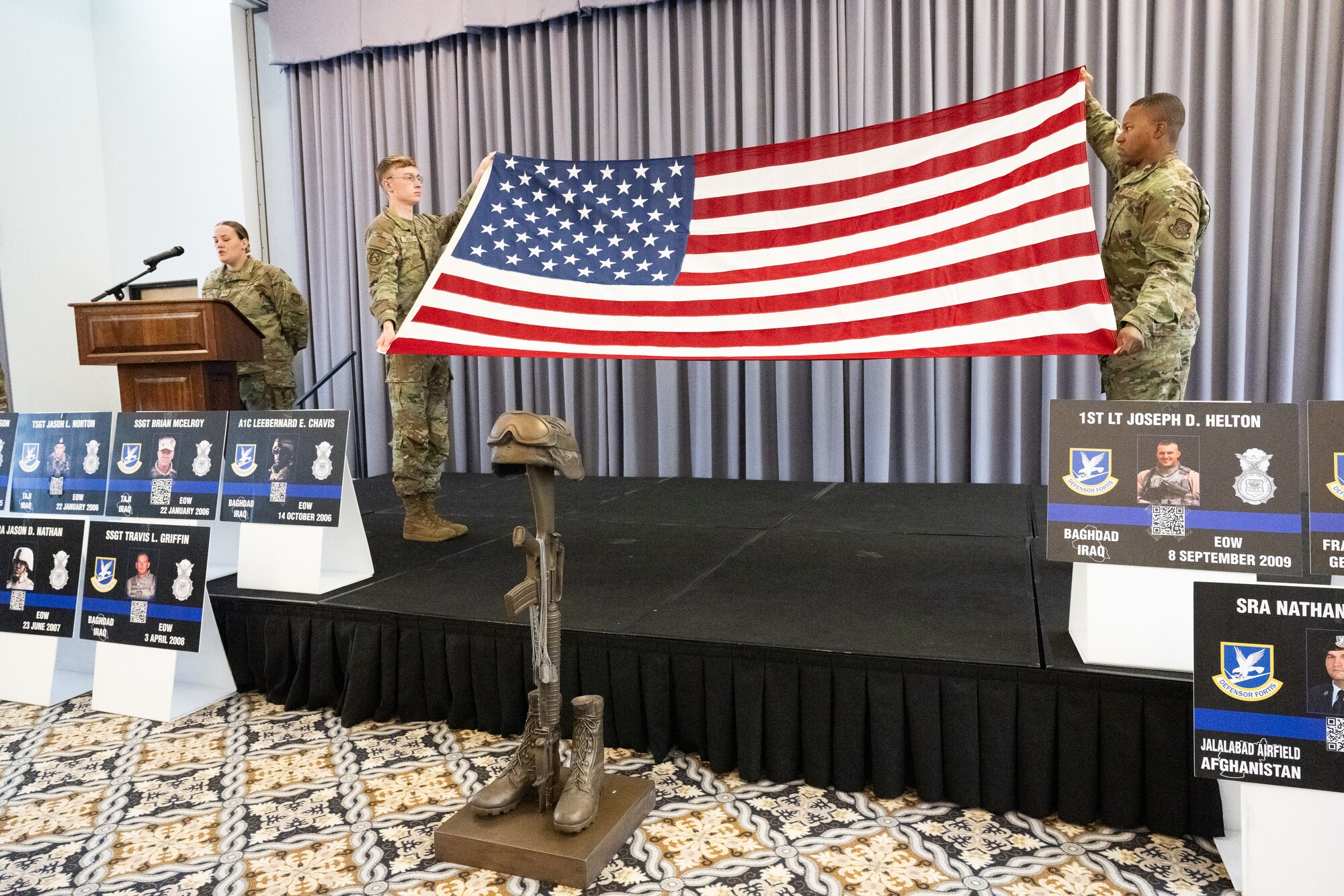 Members of Team Dover conduct a flag folding ceremony during a memorial service at the conclusion of Police Week at Dover Air Force Base, Delaware, May 16, 2025. National Police Week was established in 1962 to honor law enforcement officers and to commemorate those who have lost their lives in the line of duty. (U.S. Air Force photo by Mauricio Campino)