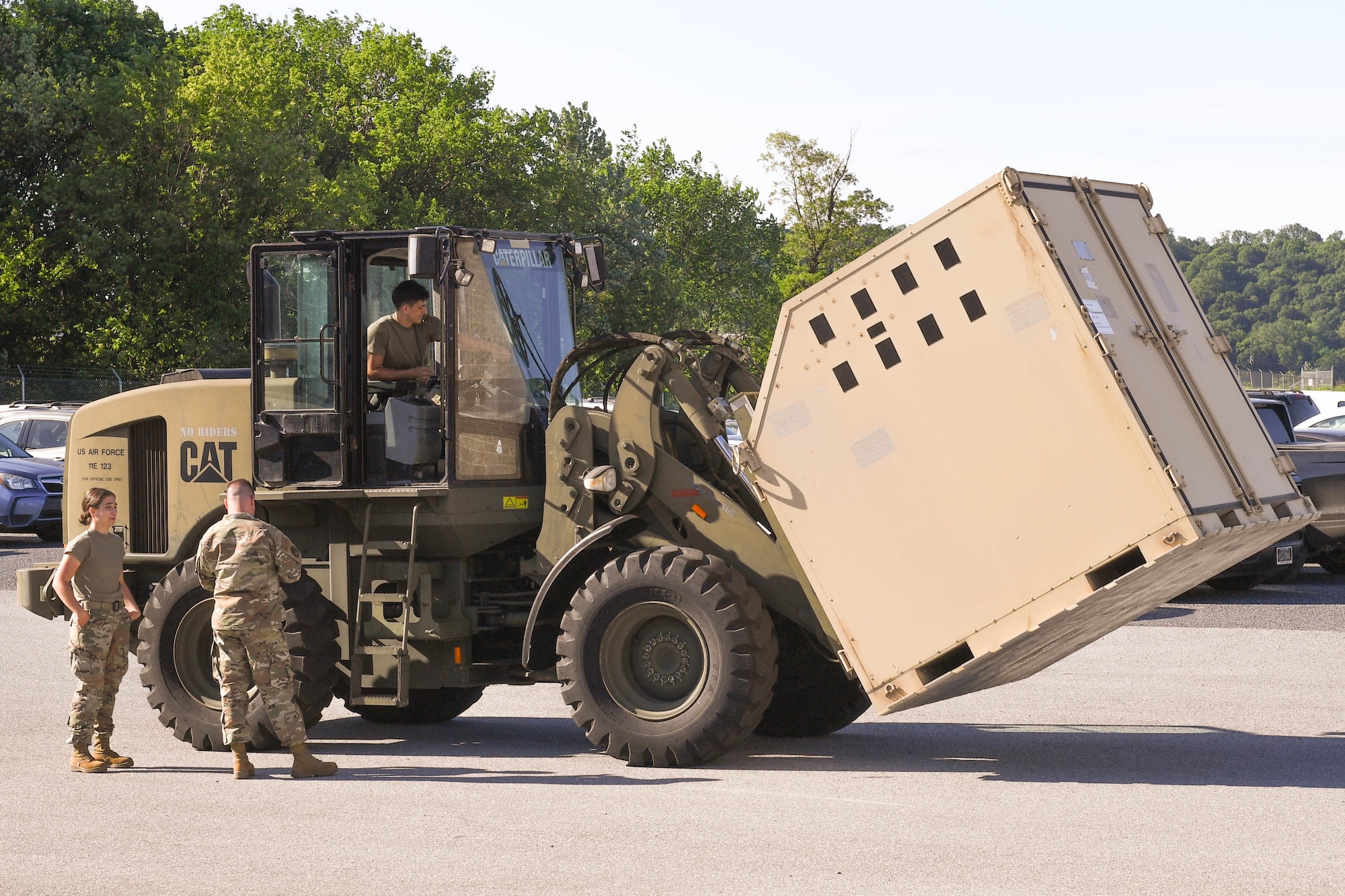 Members of the 193rd Special Operations Logistics Readiness Squadron particpate in routine duty tasks in Middletown, Pennsylvania, May 18, 2025. This squadron has just won the Air Reserve Component Base Logistics Activity of the Year for the sixth time. (U.S. Air National Guard photo by Staff Sgt. Bela Vaszlavik)