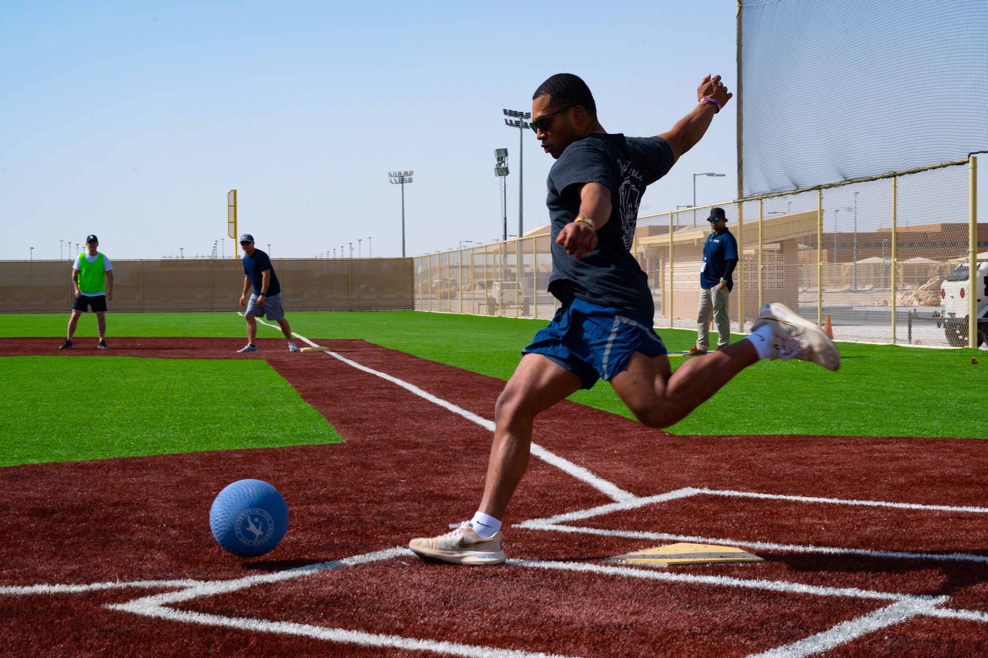 A U.S. Airman kicks during Sports Day within the U.S. Central Command area of responsibility, May 16, 2025. Kickball was one of several events held during the 379th Air Expeditionary Wing Sports Day celebration, in addition to volleyball, pickleball and dodgeball games. (U.S. Air Force Photo by Senior Airman Dieondiere Jefferies)