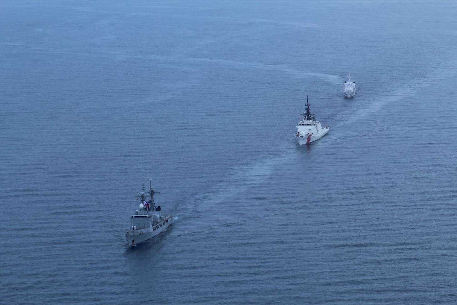 The Philippine Navy’s Gregorio del Pilar-class patrol ship BRP Ramon Alcaraz (PS-16), front left, the Legend-class USCGC Stratton (WMSL 752), middle, and Philippine Coast Guard Teresa Magbanua-class patrol vessel BRP Melchora Aquino (MRRV-9702) sail together in the Sulu Sea, May 20, 2025. Stratton is deployed and assigned to Destroyer Squadron (DESRON) 15, the Navy’s largest DESRON and the U.S. 7th Fleet’s principal surface force. The U.S. Coast Guard has operated in the Indo-Pacific for more than 150 years, and the service is increasing efforts through targeted bilateral patrols with our national security cutters, fast response cutters, and other activities conducted in support of maritime missions to enhance our regional partnerships. (Courtesy photo)