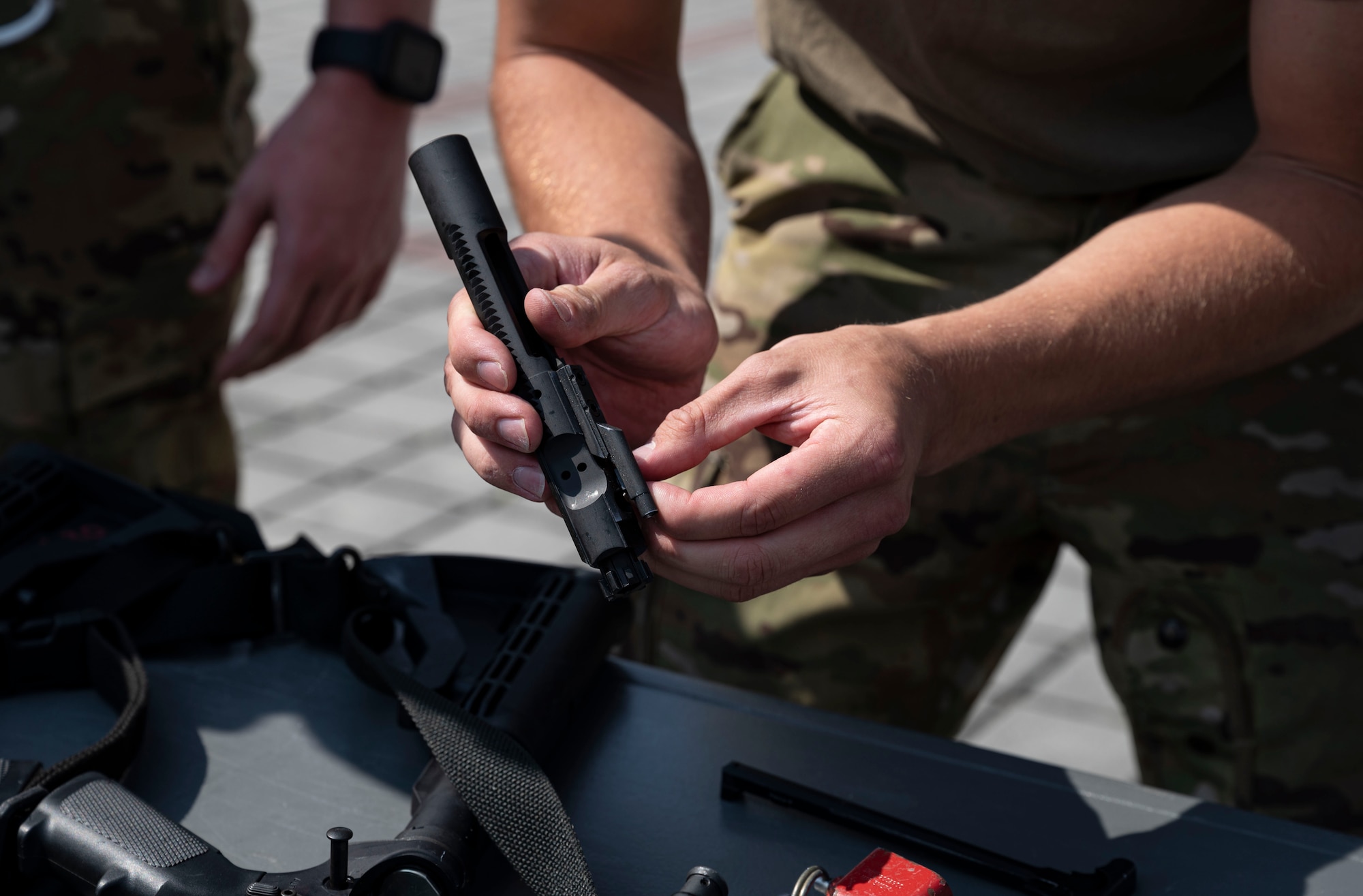 Man assembling weapon