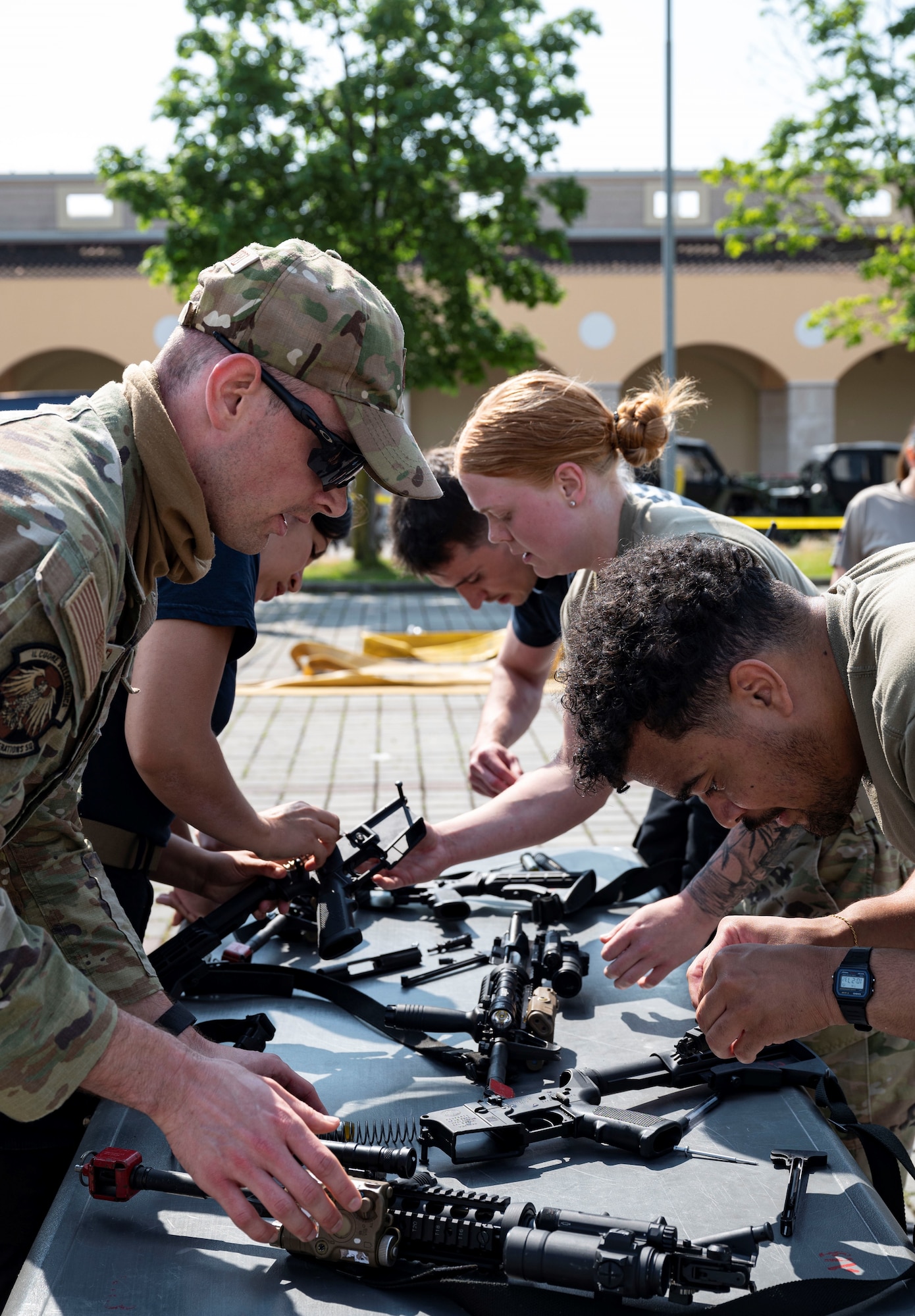 people assembling weapons