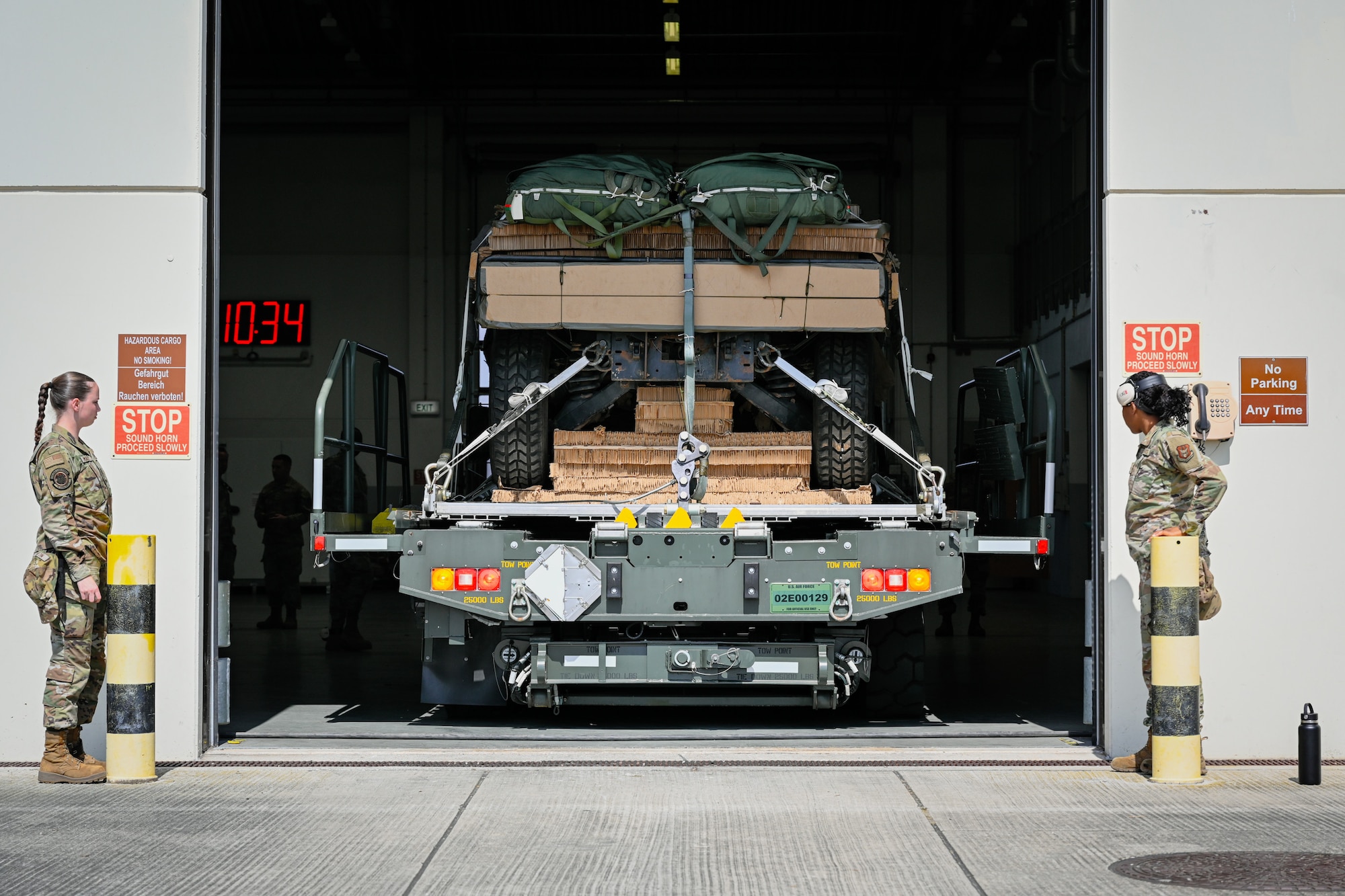 U.S. Air Force Airmen assigned to the 73rd Aerial Port Squadron help guide a 25k loader out of the 726th Air Mobility Squadron’s cargo bay during Swift Response 25 at Spangdahlem Air Base, Germany, May 15, 2025.