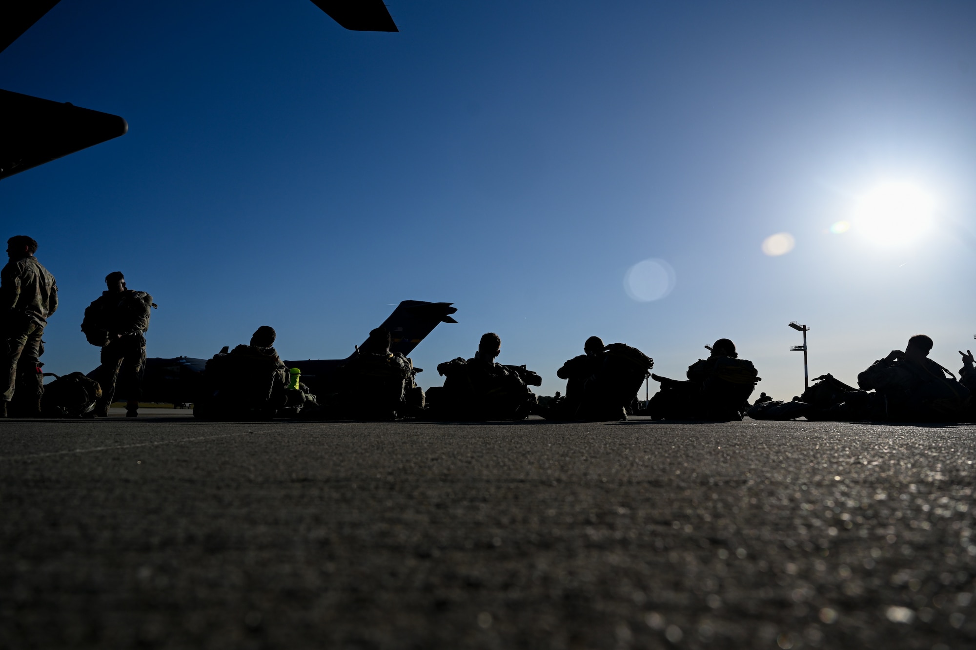 U.S. Army paratroopers from the 173rd Airborne Brigade wait to board a C-17 Globemaster III during Swift Response 25 on the flightline at Spangdahlem Air Base, Germany, May 16, 2025.