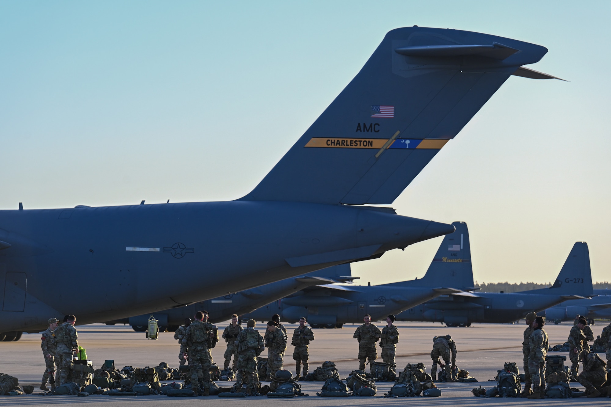 U.S. Army paratroopers from the 173rd Airborne Brigade wait to board a C-17 Globemaster III during Swift Response 25 on the flightline at Spangdahlem Air Base, Germany, May 16, 2025.