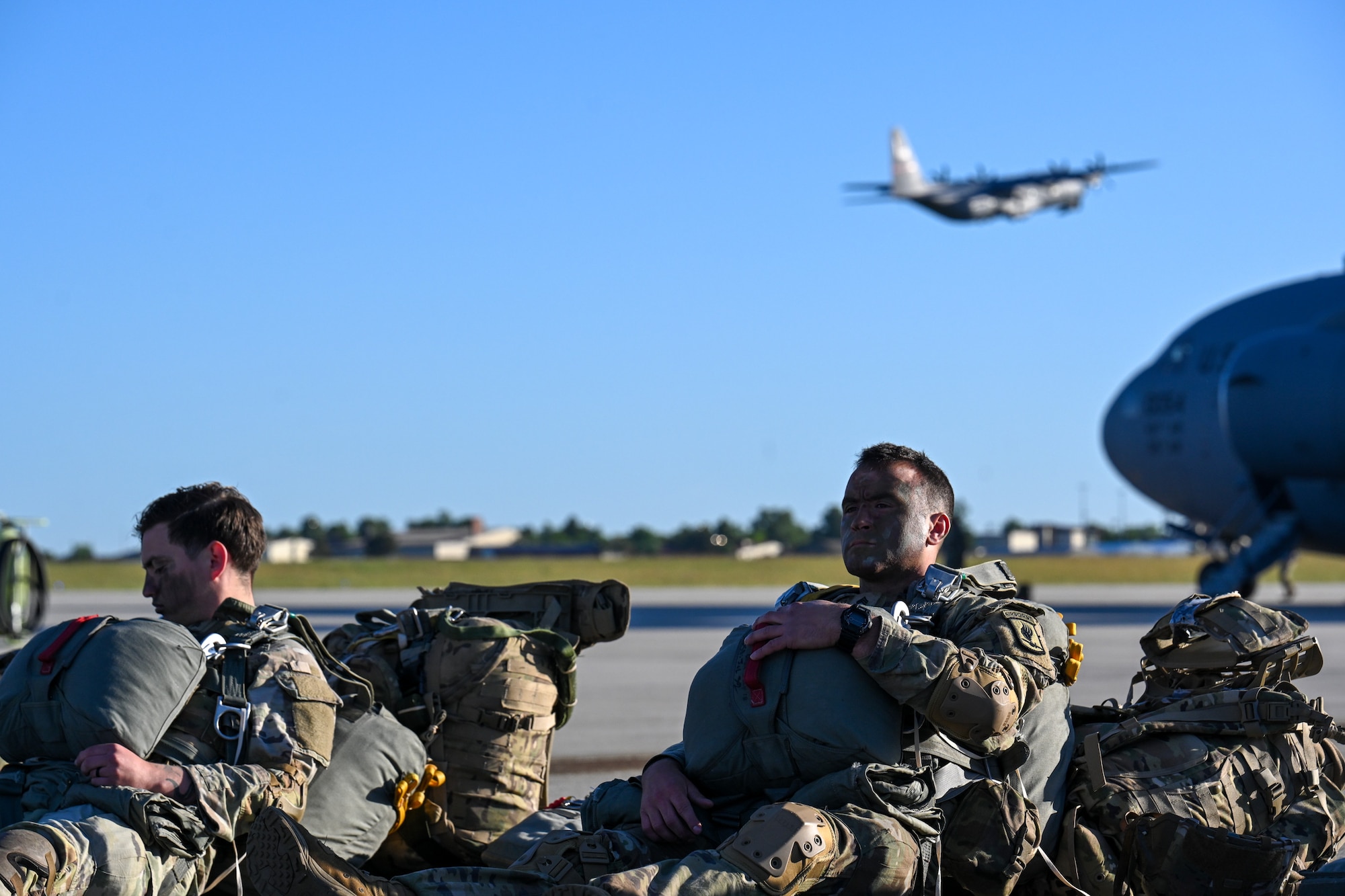 U.S. Army paratroopers from the 173rd Airborne Brigade wait to board a C-17 Globemaster III during Swift Response 25 on the flightline at Spangdahlem Air Base, Germany, May 16, 2025.