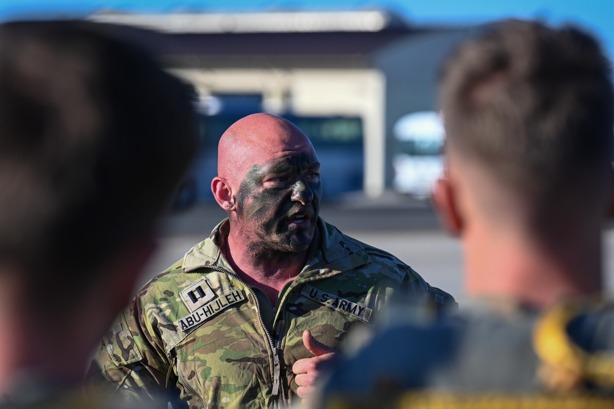 U.S. Army Capt. Jamal Abu-Hijleh, Battle Company commander of the 173rd Airborne Brigade, gives a hype speech to his troops prior to boarding a C-17 Globemaster III for a jump during Swift Response 25 on the flightline at Spangdahlem Air Base, Germany, May 16, 2025.