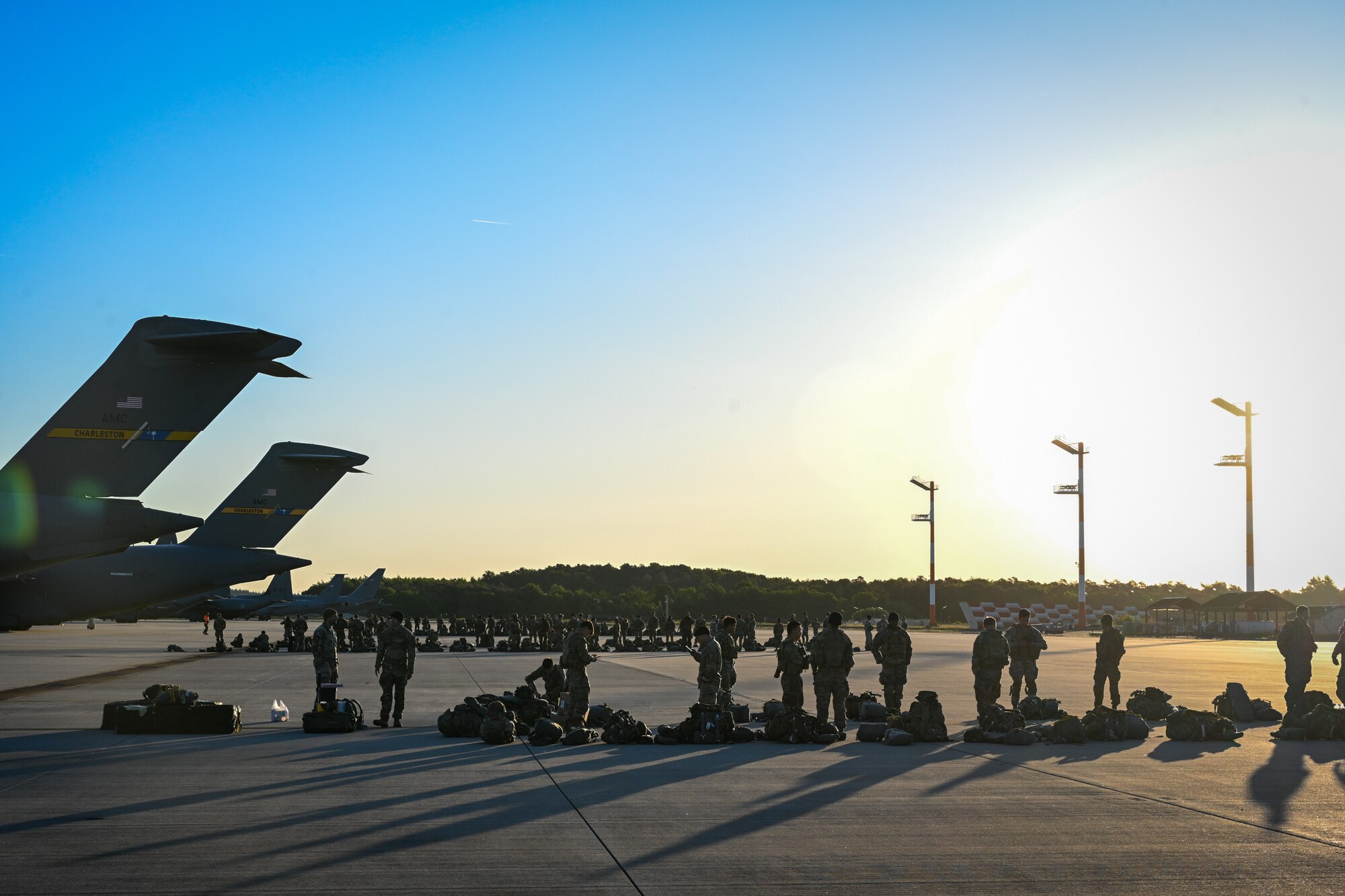 U.S. Army paratroopers from the 173rd Airborne Brigade wait to board a C-17 Globemaster III during Swift Response 25 on the flightline at Spangdahlem Air Base, Germany, May 16, 2025.