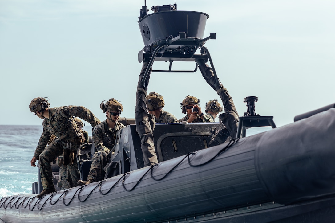 U.S. Marines with Weapons Company, Battalion Landing Team 3/6, 22nd Marine Expeditionary Unit (MEU), prepare to dock an 11-Meter Naval Special Warfare rigid-hull inflatable boat, during small boat operations as part of Amphibious Ready Group MEU exercise (ARGMEUEX), aboard the San Antonio-class amphibious transport dock ship USS San Antonio (LPD 17), Iwo Jima ARG (IWOARG), while underway in the Atlantic Ocean, May 16, 2025. During ARGMEUEX, the 22nd MEU, aboard IWOARG shipping, conducts training in support of various mission essential tasks that enhance operational readiness and lethality as a unified IWOARG/22 MEU team. (U.S. Marine Corps photo by Lance Cpl. Kyle Baskin)