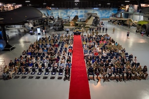 A top shot of a group of people sitting down