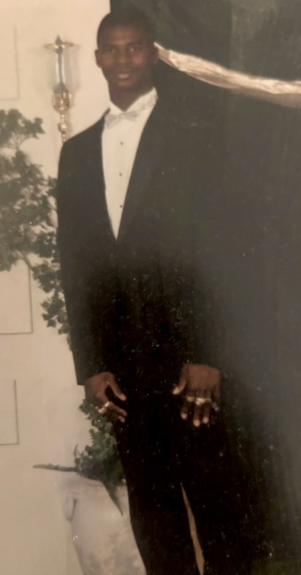 Sgt. Tyrone Chisholm poses for a photo during a senior dance at Groves High School in Savannah, Georgia.