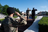 From left, U.S. Air Force Airman 1st Class Daniel Garcia, a patrolman assigned to the 11th Security Forces Squadron, U.S. Air Force Col. Ryan A. F. Crowley, commander of JBAB and the 11th Wing, and D.C. Metropolitan Police Department Chief of Police Pamela A. Smith, render a salute during the playing of “The Star-Spangled Banner” prior to the opening ceremony of National Police Week on Joint Base Anacostia-Bolling, Washington, D.C., May 12, 2025. Crowley and Smith delivered remarks highlighting the teamwork and dedication of law enforcement from JBAB and MPD. (U.S. Air Force photo by Hayden Hallman)