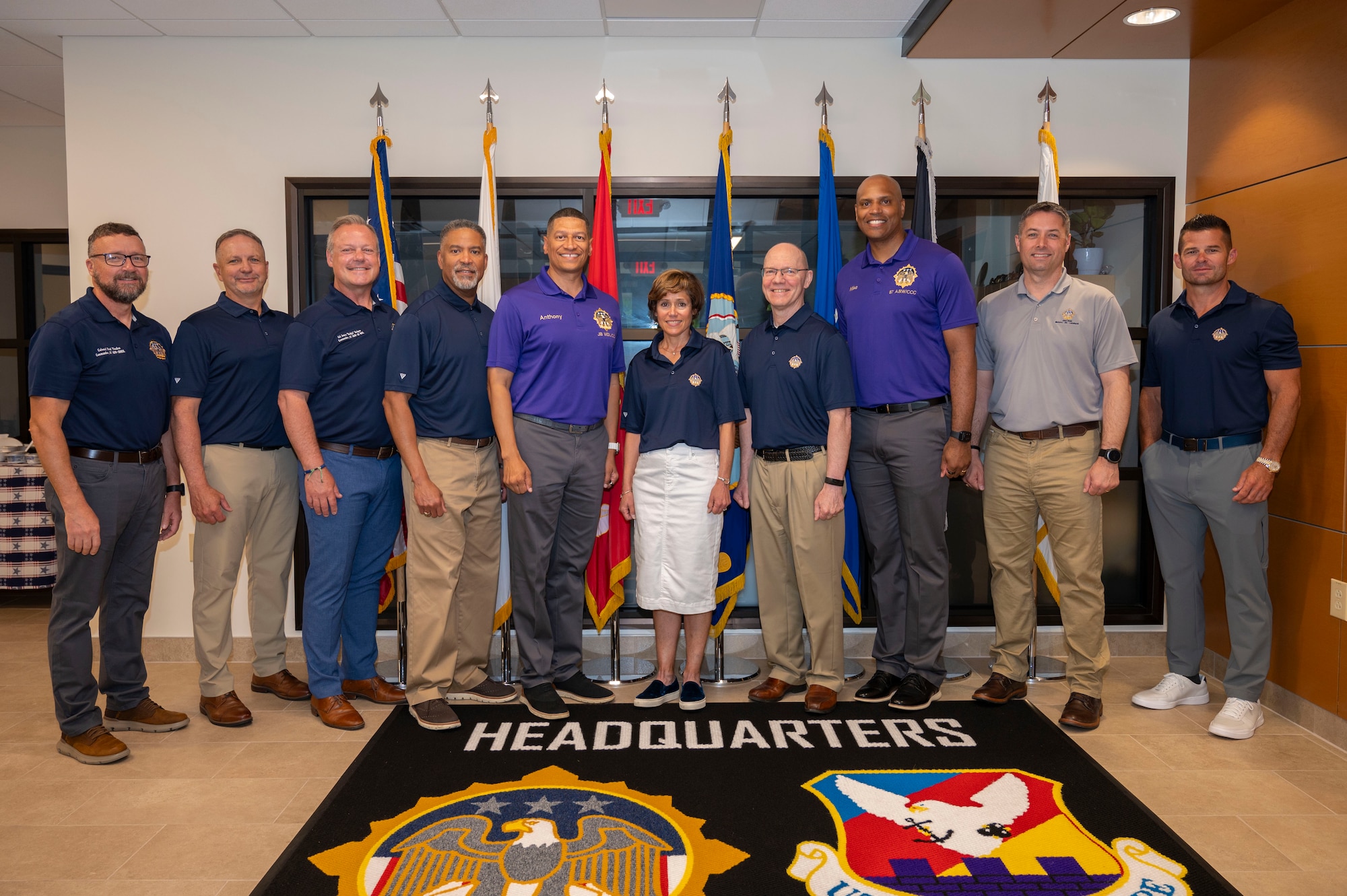 Retired Air Force Lt. Gen. Gina Grosso, prior Joint Base McGuire-Dix-Lakehurst commander, U.S. Air Force Col. Anthony Smith, JB MDL and 87th Air Base Wing commander, and U.S. Air Force Chief Master Sgt. Michael Wynne, 87th ABW command chief, pose for a photo.