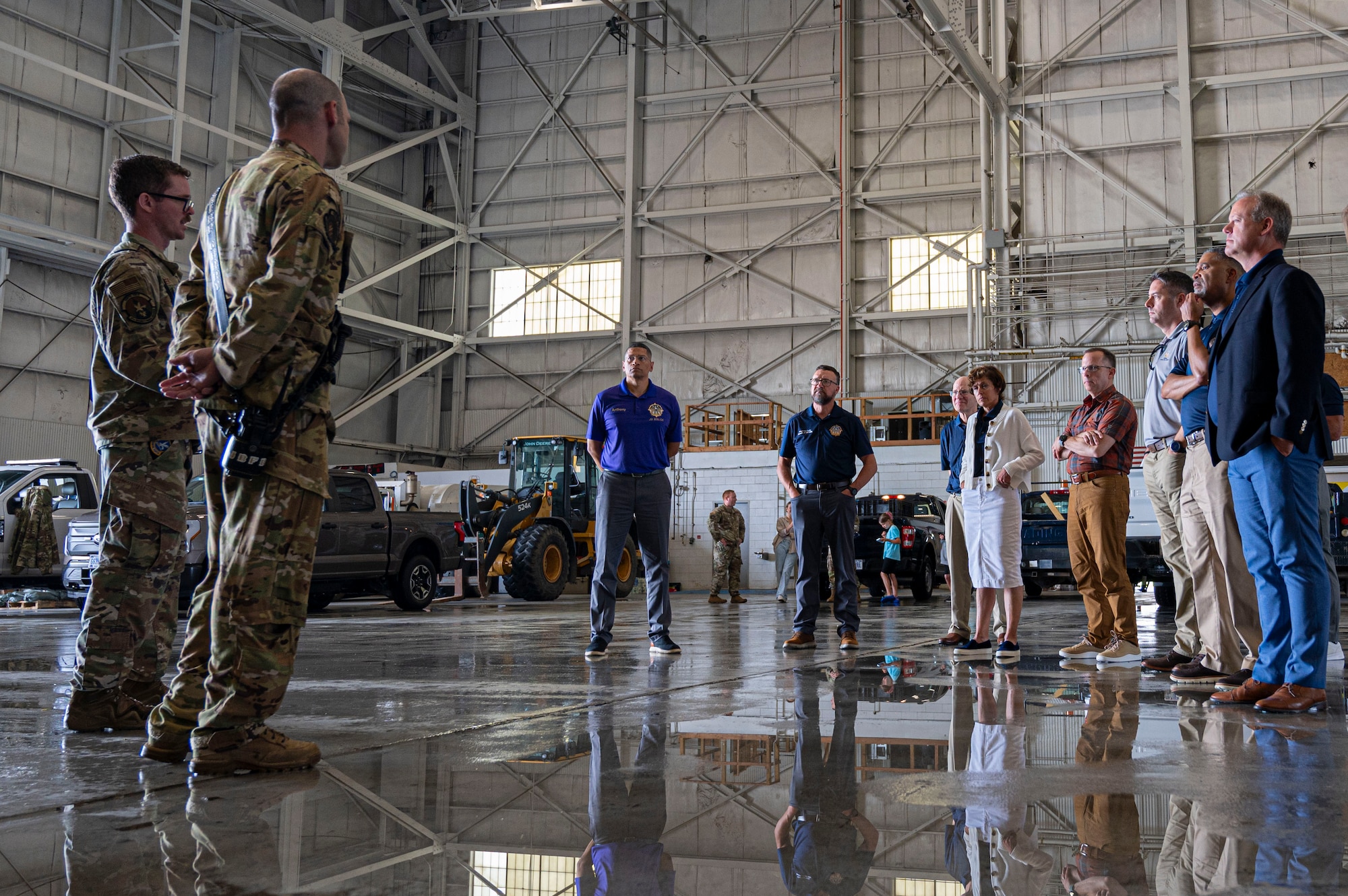 U.S. Air Force Col. Anthony Smith, Joint Base McGuire-Dix-Lakehurst and 87th Air Base Wing commander, and past leaders of JB MDL are briefed before participating in a drone demonstration.