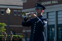 U.S. Air Force Tech. Sgt. Bradley Jones, a member of The U.S. Air Force Band, plays taps during the opening ceremony of National Police Week on Joint Base Anacostia-Bolling, Washington, D.C., May 12, 2025. The playing of taps immediately followed the reading of the names of U.S. Air Force and Navy security forces and Metropolitan Police Department members who made the ultimate sacrifice in the line of duty since the year 2000. (U.S. Air Force photo by Hayden Hallman)