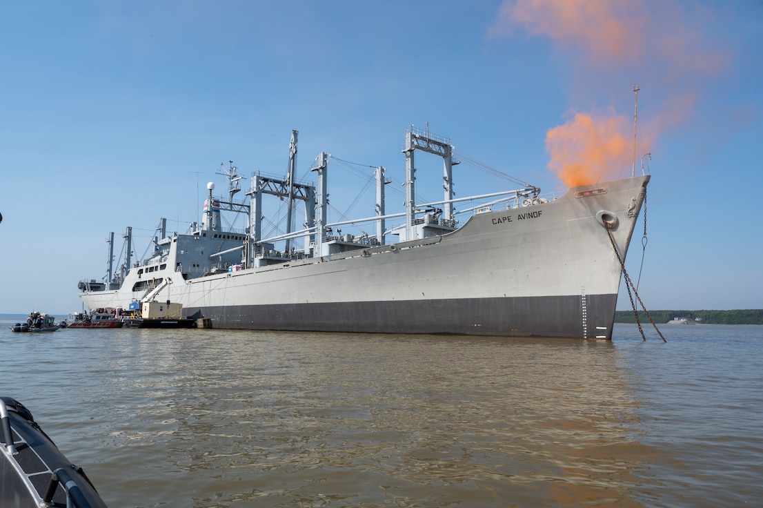 A smoking ship sails on the river. (U.S. Air Force photo by Airman 1st Class Donnell Ramsey)