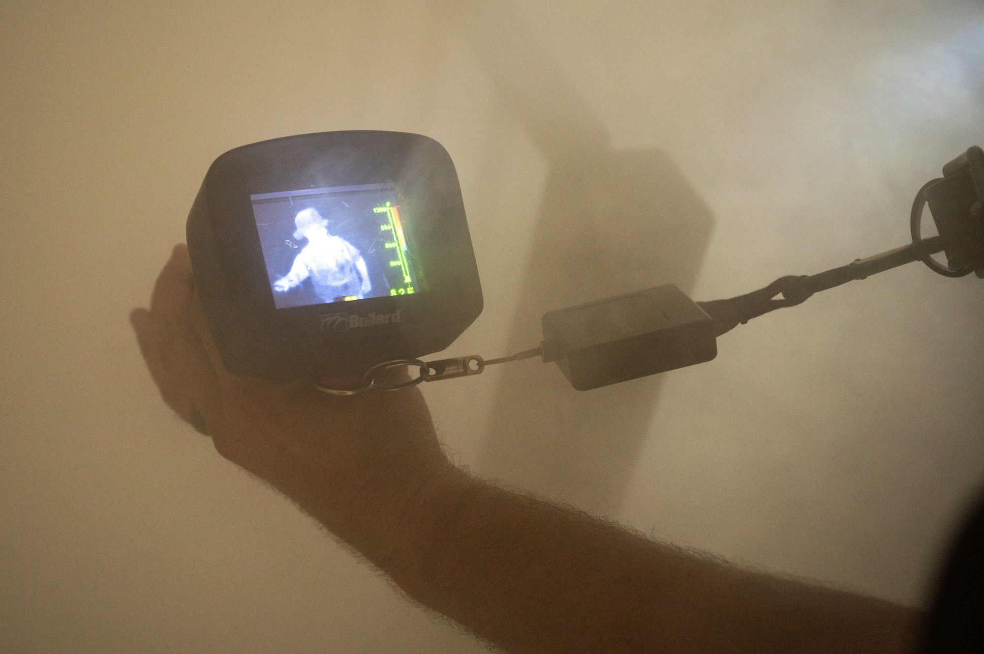Firefighter uses a device in smoke. (U.S. Air Force photo by Airman 1st Class Donnell Ramsey)