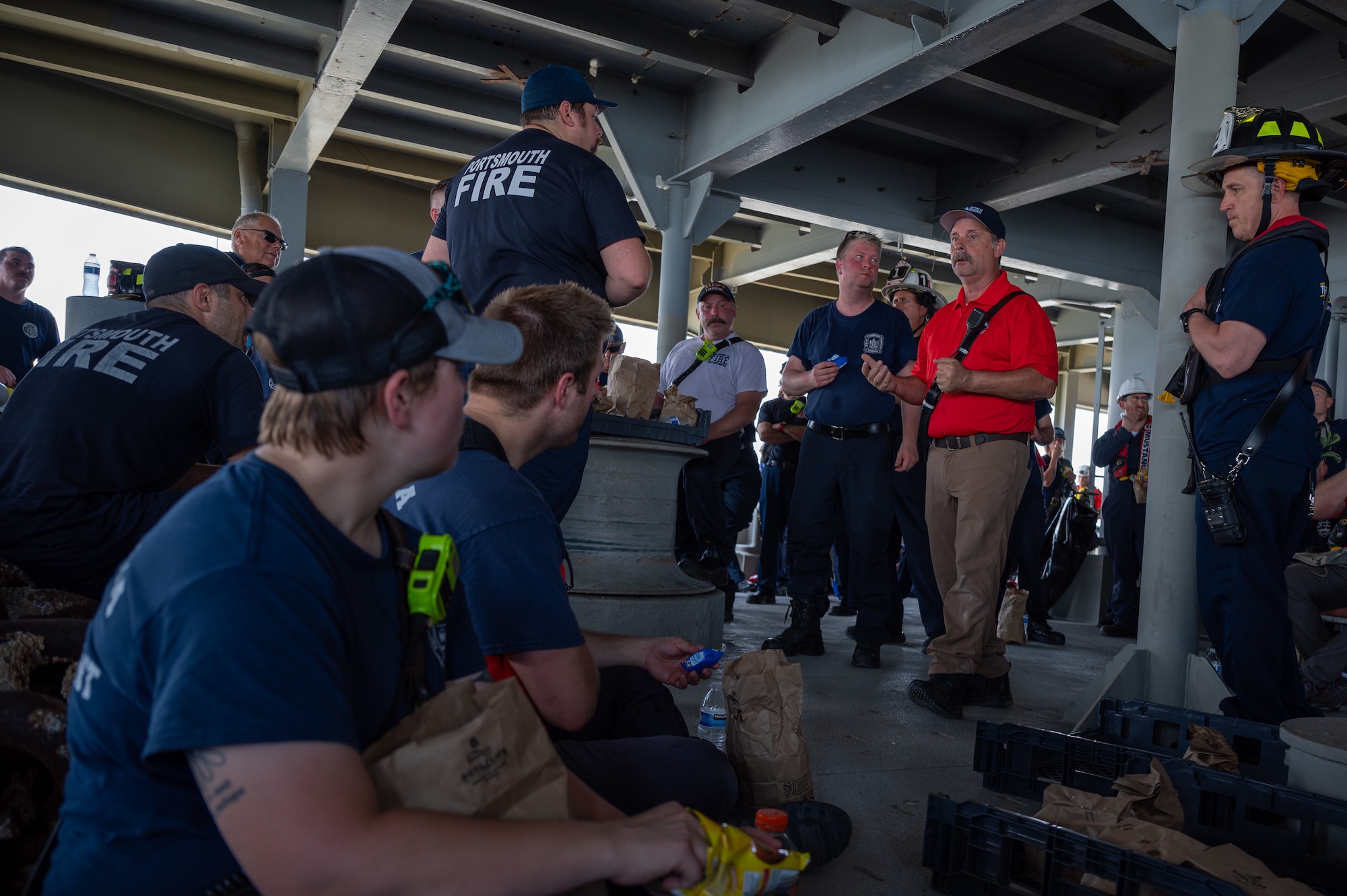 Firefighter speaks to firemen. (U.S. Air Force photo by Airman 1st Class Donnell Ramsey)