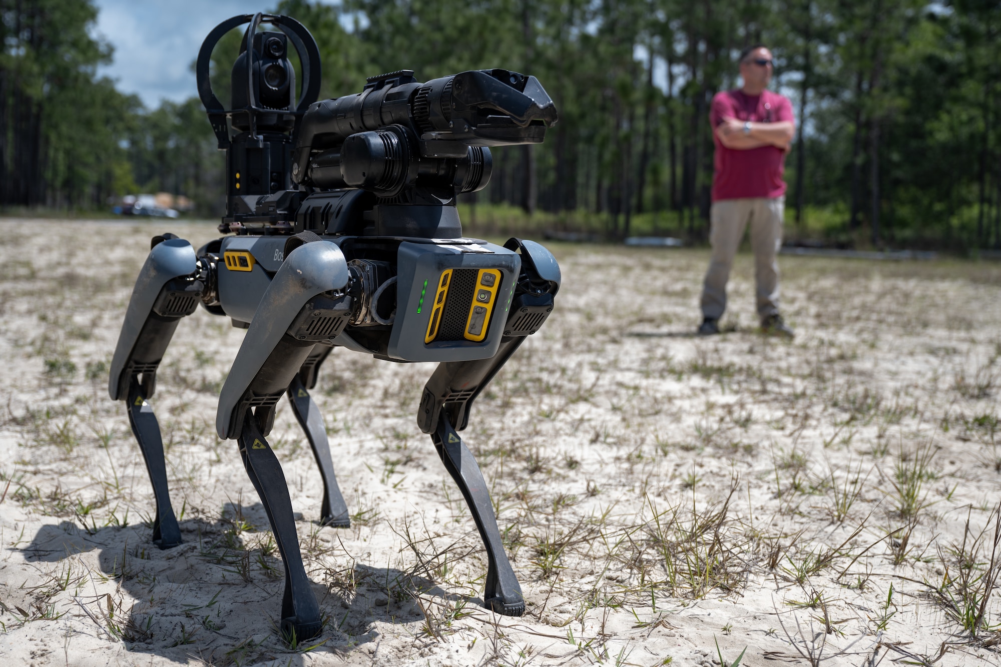 A Boston Dynamics remote-controlled robot dog patrols a training site during United States Bomb Technician Association Week at Hurlburt Field, Florida, April 29, 2025.