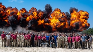 U.S. service members and Department of Defense contractors pose for a photo during United States Bomb Technician Association Week at Hurlburt Field, Florida, April 29, 2025.