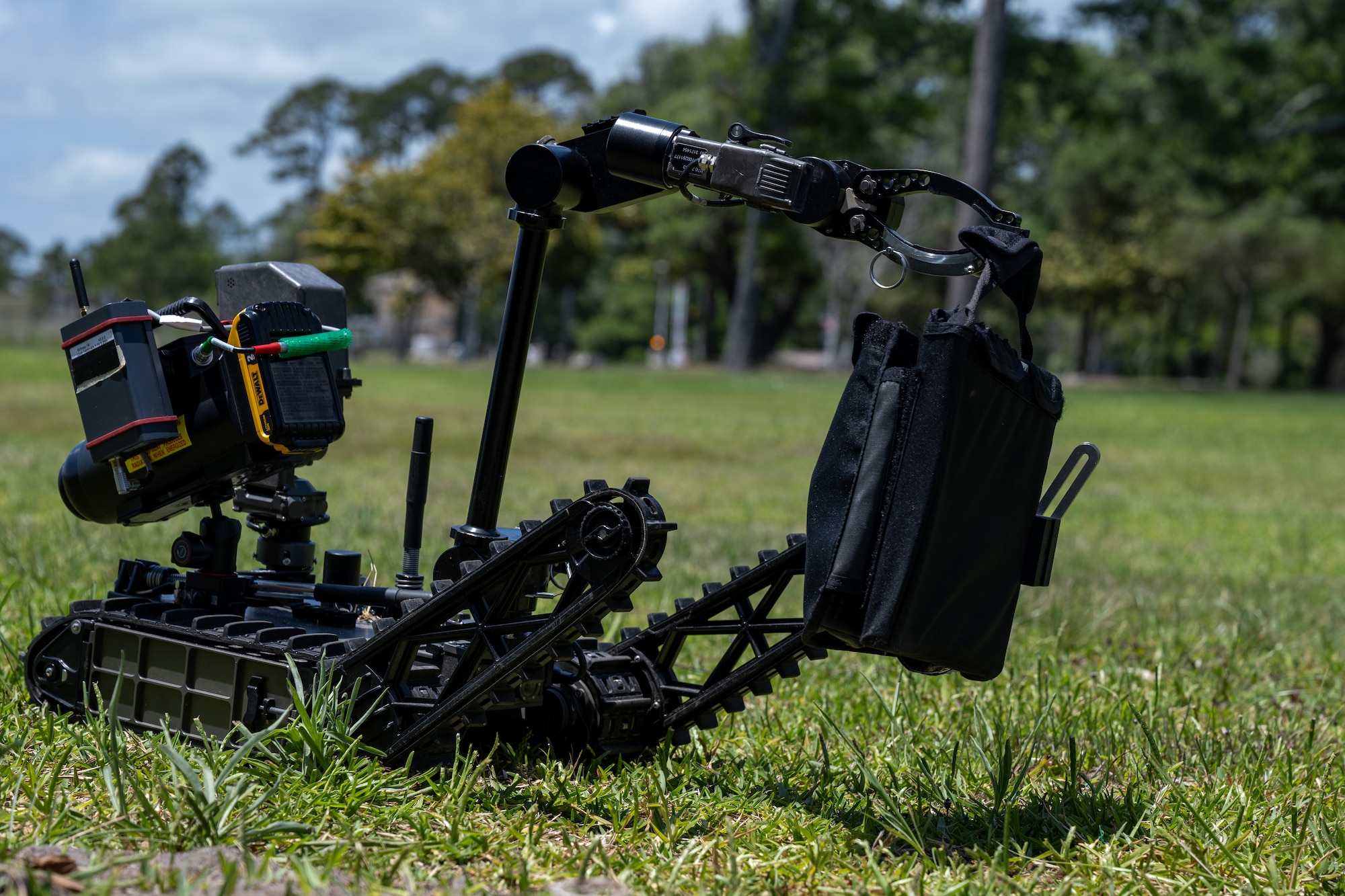 A Squad Packable Utility Robot carries a bag during a training scenario as part of United States Bomb Technician Association Week at Hurlburt Field
