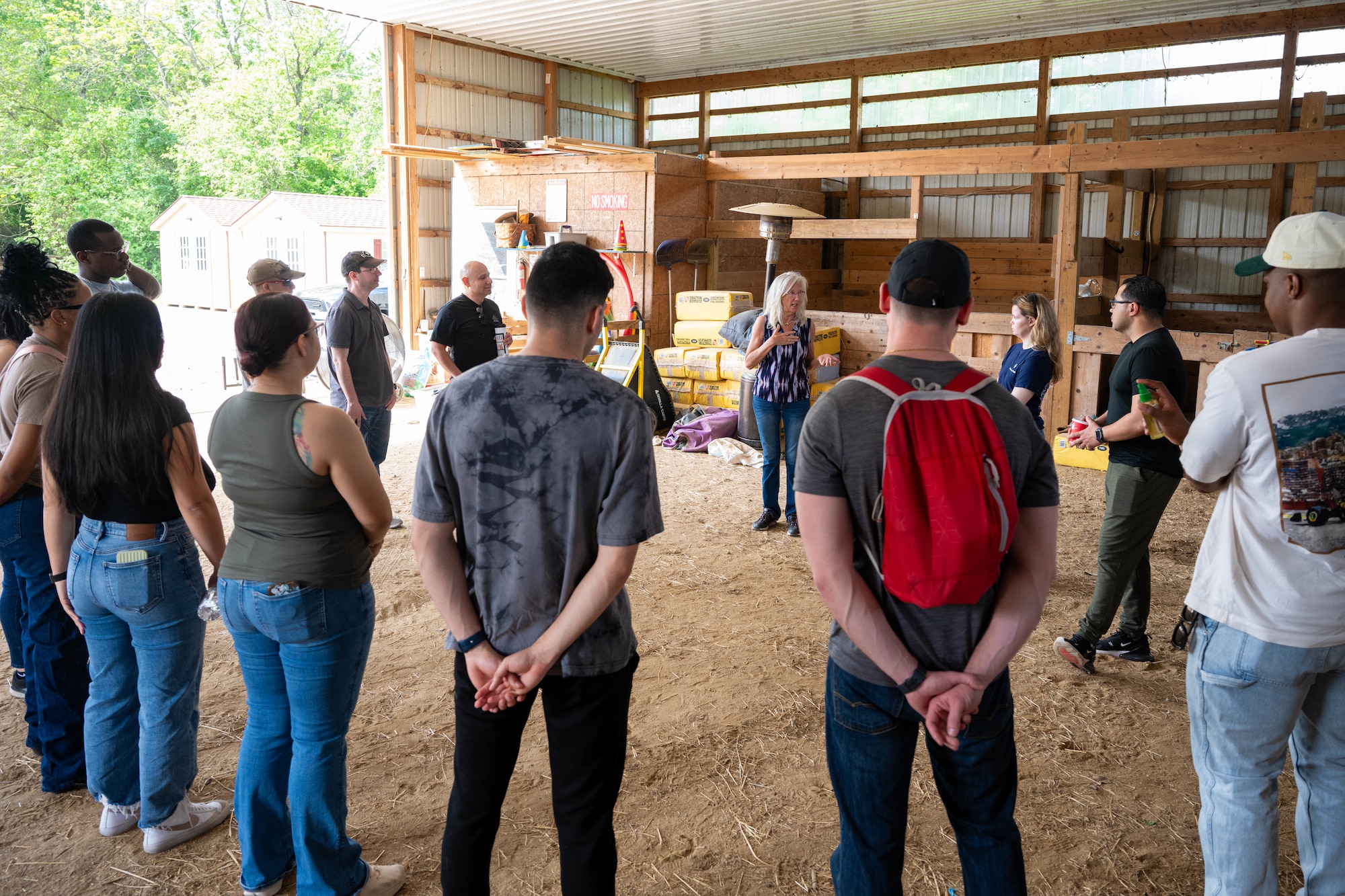 Dr. Rosemary Baugman explains the process of Equine Assisted Psychotherapy during an Air Force Mortuary Affairs Operations resilience event inside of her farm.