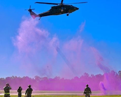 Purple smoke grenade designates the pick up site for a UH-60 Black Hawk helicopter to land during medical evacuation exercise at Patriot 25, in Perry, Georgia., March 25, 2025.