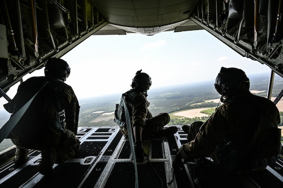 Loadmasters with the 165th Airlift Wing (AW), Georgia Air National Guard, sit on the ramp of a C-130J Super Hercules after a static line airborne jump training mission over Plantation Airpark, Sylvania, Georgia, May 2, 2025.
