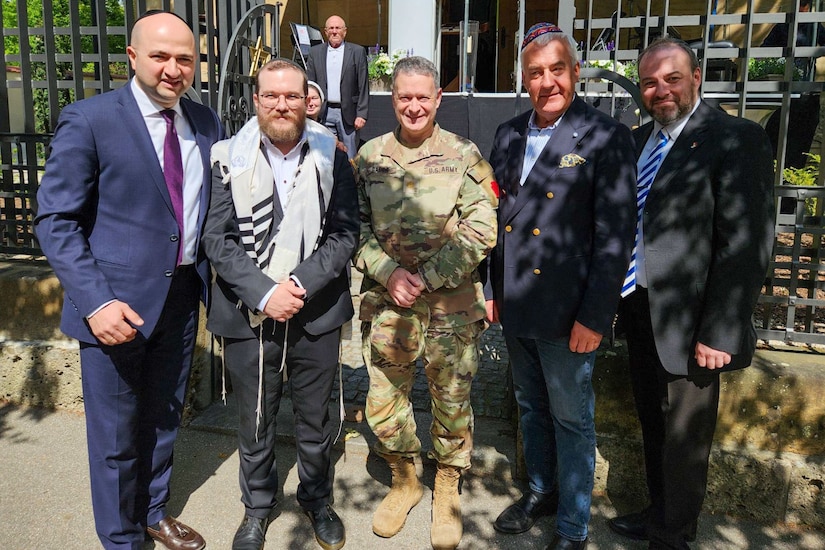 U.S. Army Maj. Aaron Gaber, center, a Jewish chaplain with the 56th Stryker Brigade Combat Team, 28th Infantry Division, Pennsylvania National Guard in support of the Joint Multinational Training Group-Ukraine mission and a guest of honor, stands with distinguished guests at a commemoration ceremony, Straubing, Germany, May 18, 2025. The ceremony commemorated the 80th anniversary of a post-World War II Jewish service at the Straubing synagogue for nearly 700 displaced persons. The 1945 Jewish service was led a U.S. Army rabbi chaplain. (Courtesy Photo)