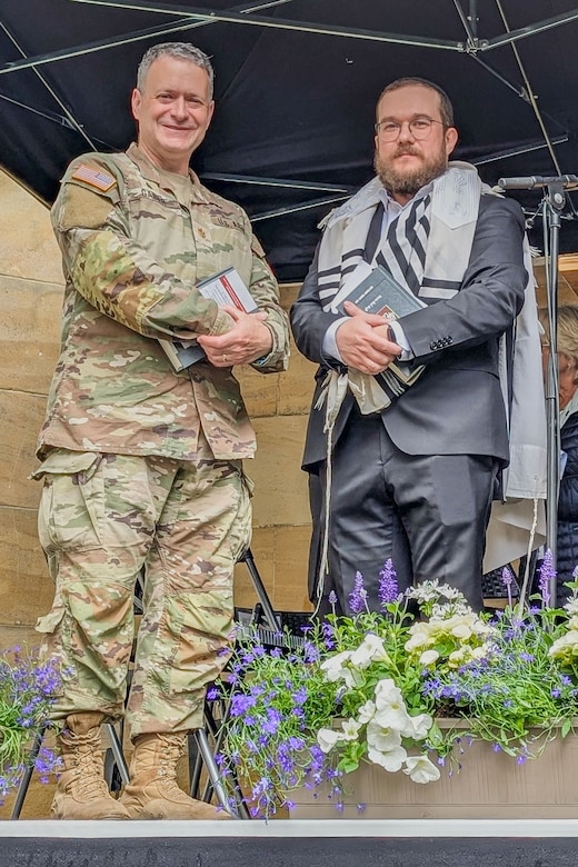 U.S. Army Maj. Aaron Gaber, left, a Jewish chaplain with the 56th Stryker Brigade Combat Team who is deployed to Germany in support of the Joint Multinational Training Group-Ukraine mission and a guest of honor, stands with Straubing synagogue's Rabbi Mendel Muraiti at a commemoration ceremony, Straubing, Germany, May 18, 2025. The ceremony commemorated the 80th anniversary of a post-World War II Jewish service at the Straubing synagogue for nearly 700 displaced persons. The 1945 Jewish service was led a U.S. Army rabbi chaplain. (U.S. Army National Guard photo by Capt. Leanne Demboski)